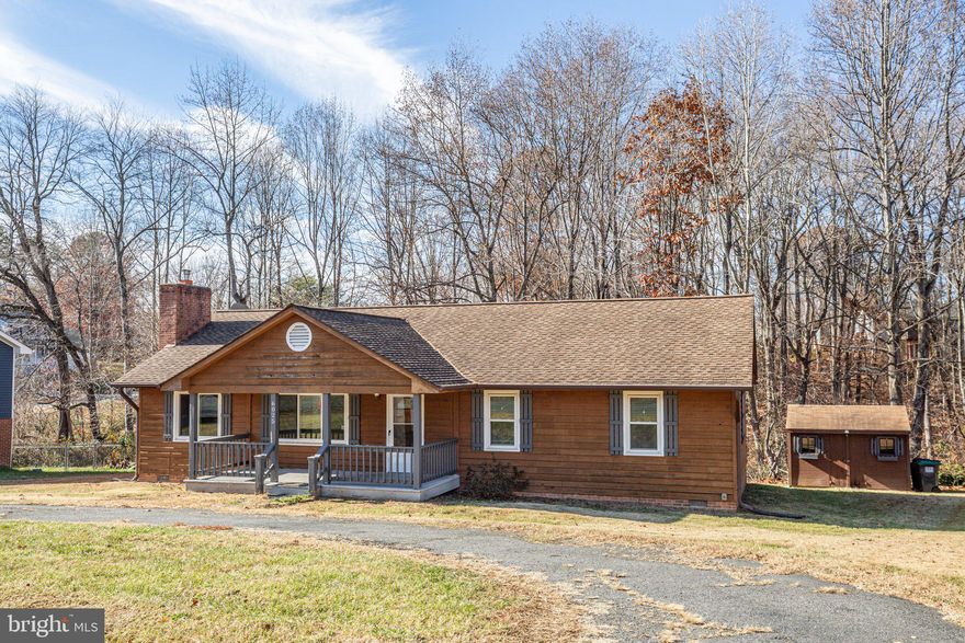 Charming single-family home in Fredericksburg with a convenient single-level floor plan. Features of the home include a covered front porch, a fireplace with a wood stove insert, an open floor plan, a separate laundry room, an updated 50-year roof, updated AC, a deck overlooking a wooded backyard with a creek, and a storage shed. The house is being sold as-is. It is ideal for first-time home buyers or investors.