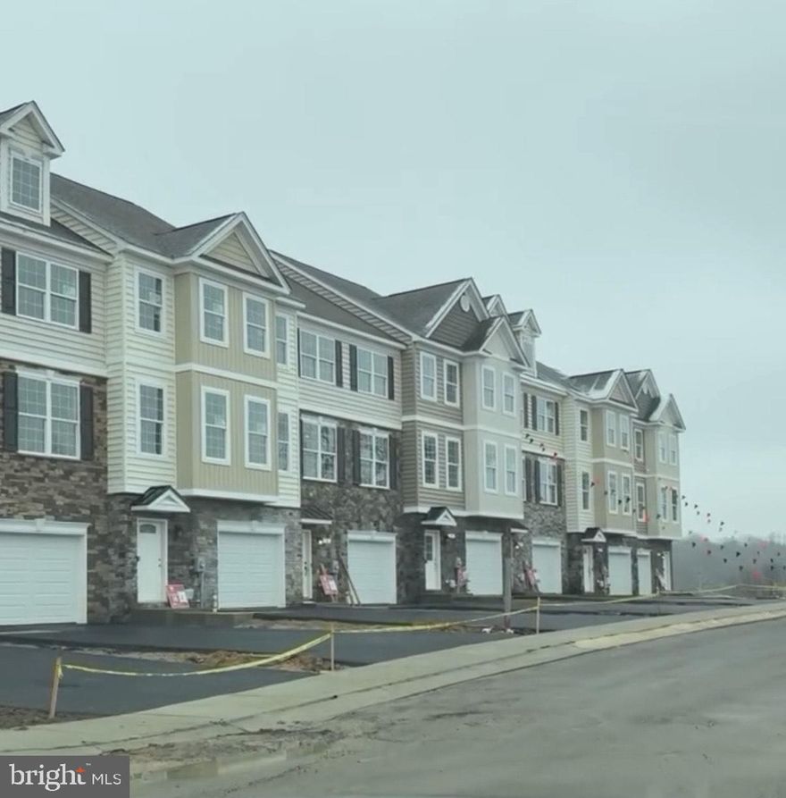 Stunning QBHI, interior unit townhome in Phase 2 of Patuxent Commons.  Features a main level bedroom and full bath with a door to the private back yard (privacy fencing included). Oversized garage and mudroom with bench and cubbies. If you do not need the additional bedroom, it also makes a great extra recreation room.  When you enter through the front door there is an added bench with cubbies, perfect for storage. 2nd level features a spacious Kitchen with Upgraded kitchen cabinets, appliances, and gorgeous granite. This unit has the Breakfast bar. Huge Pantry, LVP flooring, table space area and walk out onto the 14'x12' maintenance free deck or relax in your large family room.  Upper level has a large primary suite with tray ceiling, walk in closet and an on suite bath with QBH's signature "Deluxe shower."  2 additional bedrooms and hall bath, plus laundry room.  Call for more information.