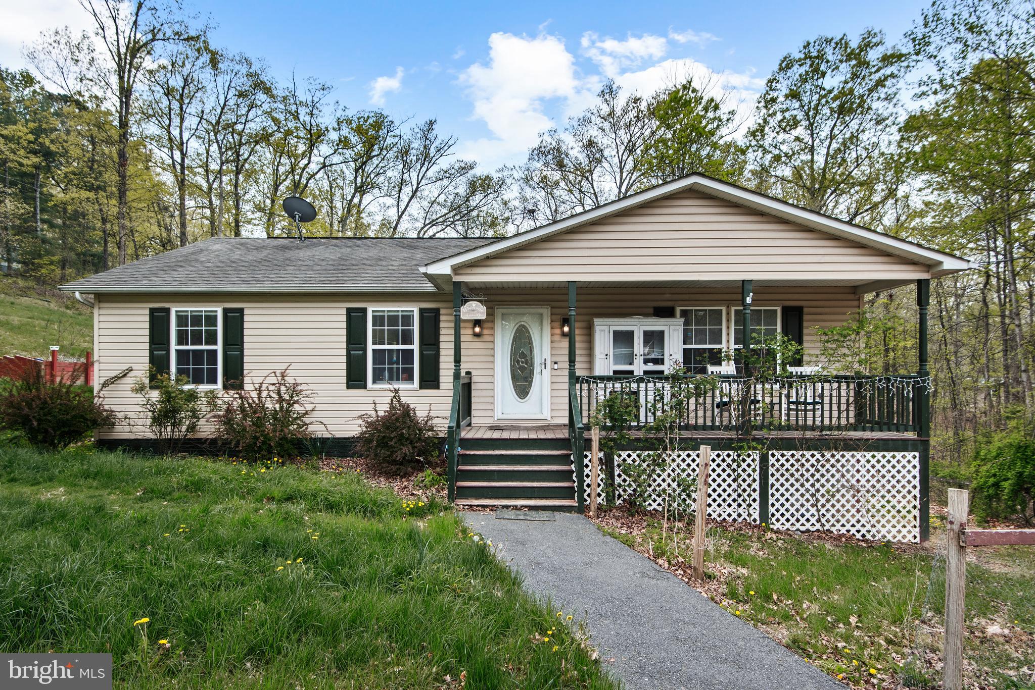 Come check out this lovely 3-bedroom, 2-bathroom home nestled right in the heart of the Shenandoah Farms community. It offers a welcoming, spacious living room and a comfortable dining area just off the kitchen. The primary bedroom has its own private bathroom for added convenience, while the other two bedrooms are roomy and perfect for family or guests. There's also a hall bathroom for everyone’s comfort.
The unfinished basement gives you the exciting opportunity to expand your living space—potentially almost doubling the size of the home—washer and dryer are in the basement. Also a walkout door for convenience. There is a rough-in for a bathroom. Situated on a corner lot just shy of an acre, the property boasts nice open spaces and some wooded areas, providing a wonderful sense of privacy and tranquility.