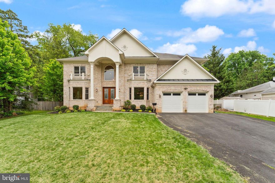 A MASTERPIECE OF CUSTOM CRAFTSMANSHIP IN THE HEART OF FAIRFAX.  Imagine a home that perfectly balances stately brick architecture with the warm, inviting hum of modern luxury. Poised on a rare half-acre level lot in the vibrant heart of the City of Fairfax, this custom-built estate offers an extraordinary 7,474 square feet of refined living space. From the moment you pull up the expansive driveway, which comfortably accommodates six vehicles, you’ll realize this property was designed for those who refuse to compromise on space, style, or location.  THE MAIN LEVEL: ELEGANT FLOW & EVERYDAY FUNCTION.  Step through the front door into a grand formal foyer that sets a sophisticated tone for the rest of the home. To your left and right, the formal living and dining rooms stand ready for holiday gatherings, while the rest of the floor unfolds into a masterpiece of open-concept design.  The true heart of the home is the chef-inspired kitchen, featuring a butler’s pantry for seamless entertaining and a large walk-in pantry for effortless organization. Sunlight pours into the breakfast area, while the adjacent family room, anchored by a custom fireplace, invites you to kick back and relax.  Tucked away for privacy, the main-level bedroom with a full bathroom offers the ultimate flexibility—perfect for a secluded home office or a welcoming guest suite.  A conveniently located main-level powder room provides an elegant comfort for guests.  Even the smallest details are considered, including a dedicated pet washing station for your four-legged family members and direct garage access through the kitchen for easy grocery unloads.   THE UPPER LEVEL: A PRIVATE FAMILY SANCTUARY.  Ascend to the upper gallery, where a beautiful balcony overlooks the foyer, leading you to a versatile loft space—ideal for a secondary family lounge or homework zone.  The Owner’s Suite is a sprawling retreat featuring a private sitting room, dual oversized walk-in closets, and a spa-like ensuite bath that promises total relaxation.  The second bedroom enjoys its own private ensuite, while the third and fourth bedrooms are connected by a thoughtfully designed Jack and Jill bathroom, ensuring every family member has their own sense of space.  THE LOWER LEVEL: THE ULTIMATE ENTERTAINMENT DESTINATION.  The fully finished basement is an entertainer's dream, designed with functional distinct zones   A central Recreation Room with its own fireplace is flanked by a built-in bar on one side and a spacious billiards or game area on the other.  Experience the magic of the movies in your private theater room, and utilize the two additional bonus rooms as a home gym, secondary office, or extra guest quarters.  The full basement bathroom adds a layer of luxury and ease.  The wide walk-up stairs provide easy, direct access to the backyard.   THE EXTERIOR AND FINE FINISHES.  This Energy Star Version 2.5 Qualified Home isn't just beautiful; it’s built for longevity and efficiency. Throughout the interior, you’ll notice bullnose corners, a high-end finish that offers enhanced aesthetics and superior durability.   The large, level, and fenced backyard is a rare find in the city, providing a safe and expansive canvas for gardening, play, or future outdoor projects.  Beyond the two-car garage with ample room for storage, the long driveway ensures you never have to worry about parking for guests.   THE LOCATION:  CONNECTED TO EVERYTHING.  You are perfectly positioned at the crossroads of nature and urban convenience.   Walk to the shops at Fair City Mall, or take a short drive to the world-class retail at Mosaic District, Tysons Corner, and the charming streets of Old Town Fairfax.   Effortless access to I-495, I-66, and Route 50. You are minutes from the Vienna/Fairfax-GMU and Dunn Loring Metro stations, as well as GMU, NOVA , and Inova.  This home offers an unparalleled blend of luxury and connection to the best of Northern Virginia.
