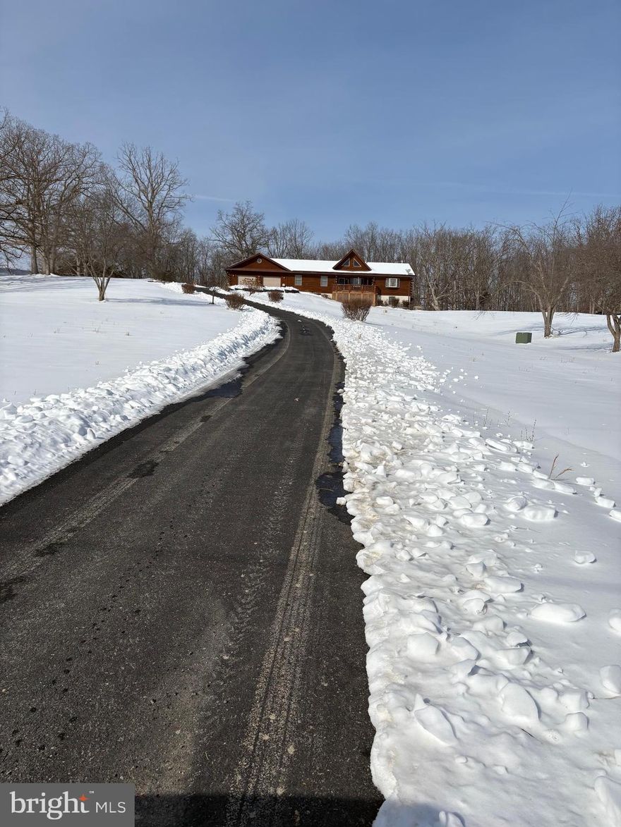 Beautiful log home with private setting and gorgeous views of the WV mountains.  Enjoy this home and location in any season of the year.  5 bedrooms with 3.5 bathrooms with over 3,392 sq. ft of living space.  Plenty of room to relax and entertain friends and family.  Paved driveway, garage, pavilion and storage shed, 24K whole house Generac generator.  Must see to appreciate the quality and features of this home.  Located near to Moorefield which provides dining, shopping and other conveniences.