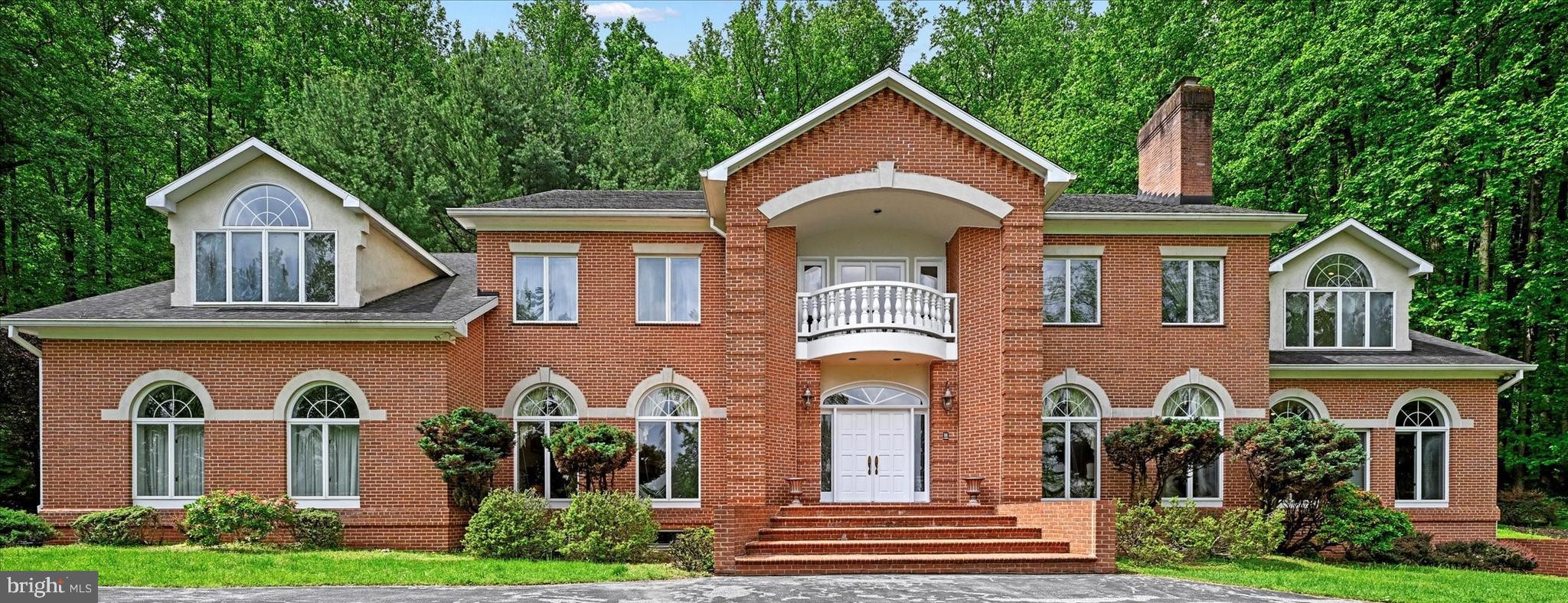 Price Reduced! Welcome to 5 Chamaral Court. This Stunning Custom-Built Home, tucked-away on almost 7+ acres of beautifully landscaped grounds offer over 9400 total square feet, featuring 6-Bedrooms, 5-Full Baths, oversize 3-Car Garage. Fantastic Ivy Hill location with stellar views of hunt valley, one of most sought-after areas in Baltimore County. The house is nestled on the hillside through a private driveway that exudes an air of exclusivity and tranquility. Looking down at the views surrounded by lush greenery and towering trees, a sense of anticipation builds, drawing you closer to the treasure that awaits. As you step inside, you'll be greeted by a dramatic foyer with high ceilings, marble floors laid on a diagonal, a curved staircase and a stunning chandelier that cascades a warm glow throughout. Through the foyer, a fabulous family room offers rustic elegance along with a stunning two-story high ceiling with a fireplace, built-ins, and a wall of French doors with large radius transoms allowing an abundance of natural light.
On the left side of foyer, a spacious generously proportioned dining room awaits. While, on the right is the cozy living room, with a fireplace, invites you to unwind and enjoy moments of quiet contemplation, while the adjacent formal dining room sets the stage for memorable gatherings and celebrations.
Adjunct to the living room, a huge customer designed library awaits with walnut built-ins and wood burning fireplace.
In the main floor, customer designed spacious gourmet kitchen with a center island with countertops is complemented by a spacious eat-in area with a dome ceiling and window surround that seamlessly connects you to the outdoor living area. For more formal occasions, the dining room offers an elegant setting. Upstairs, the luxurious primary suite with a sitting area, two walk-in closets. Spa-like bathroom equipped with marble flooring, a relaxing jacuzzi tub, and a walk-in shower, etc. In addition, there are four additional bedrooms all generous in size with plenty of closet space and two full bathrooms upstairs. A convenient guest bedroom is on the main floor with a full bathroom. At the lower level, the unfinished huge basement with walk-out that offers so many possibilities! The house surround is a private paradise with a circular drive, a two-car garage, abundant storage space, mature trees, and a spectacular patio for enjoying the serene surroundings. The house offers a seamless blend of indoor and outdoor living, creating a harmonious flow that enhances the overall living experience, inviting nature's beauty to become an integral part of your daily life. The house is more than just a home! Schedule your private tour today and experience the allure of living at its finest. The seller is highly motivated to sell this house. The government assessment value for this house in 2023 is about $1440k. The current listing price is about the same as the government assessment value. Don't miss out on the opportunity to make it your dream home!.