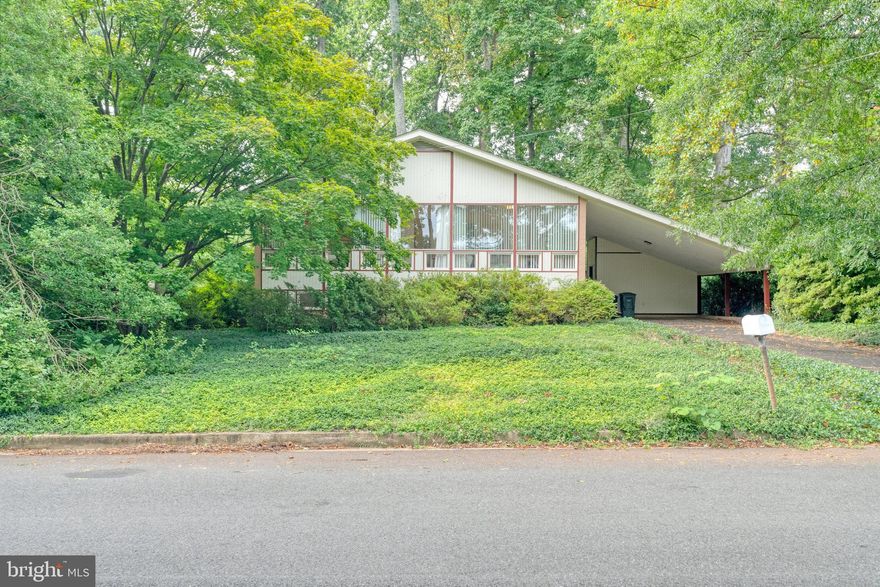 Premium .45 acre  wooded lot with Mid-Century Modern home in need of total renovation, or build new. 
This is a once in a lifetime chance to own a property that's been lovingly cared for by the same owner for over 62 years.
A premium lot  just blocks to downtown McLean,  1/2 block to a 10 acre park, a stones throw to the community center, tennis courts  and library and  less than 3 ml to  Metro . A private & tranquil setting in a sought after school  pyramid, minutes to downtown DC and close to major highways . This stunning property is a nature lovers dream, a perfect blend of convenience and privacy in a neighborhood of multi-million dollar homes.
Lot supports a side load garage and grading supports a walkout basement. It's everything you could want from a building site and more!
Mid Century Modern home being sold strictly "as is". Very liveable but in need of total renovation.