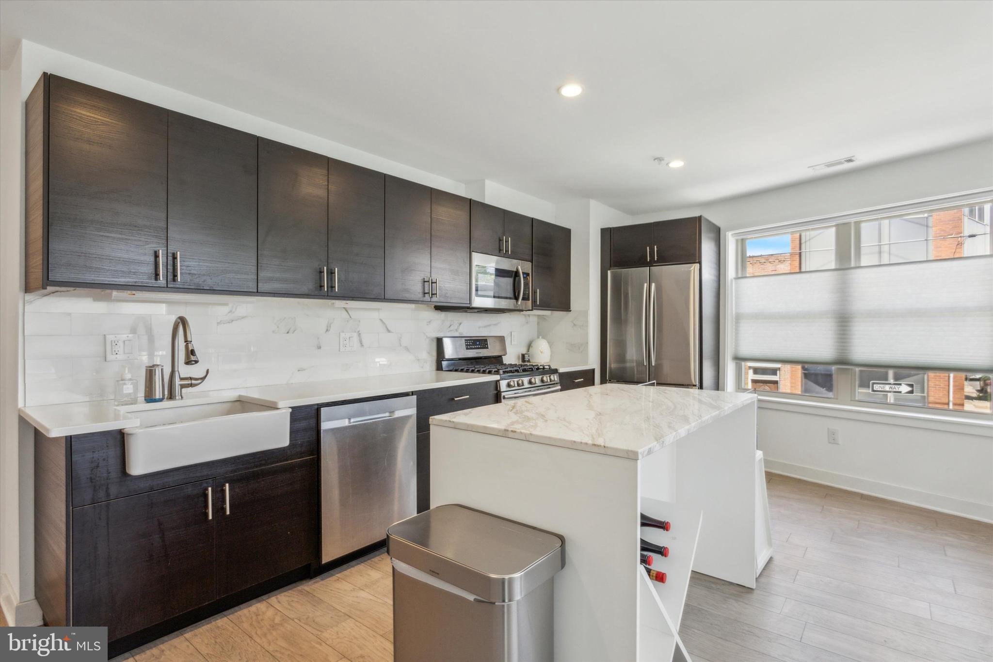 Welcome to your dream home in Point Breeze! This sleek and stunning, corner unit condo offers the perfect blend of modern living and urban convenience over three floors. With three spacious bedrooms, two full bathrooms, engineered hardwood flooring running throughout the unit and windows galore, this bright and airy home provides a stylish and comfortable retreat in one of Philadelphia's most vibrant neighborhoods. Recently constructed there are still approximately 4 years remaining on the tax abatement, providing significant savings and making this an even more attractive investment.
The first living level consists of a fully equipped modern kitchen with stainless appliances, a ceramic farmhouse sink, and quartz countertops adjacent to the dining area. Heading up one level is the primary suite with a large bedroom and stunning bathroom with a freestanding soaking tub, walk in shower and dual vanity, all outfitted with modern fixtures offering both style and functionality. In the hallway you'll find the in unit washer and dryer, providing maximum convenience. The top living level consists of two generously sized bedrooms and a second full bathroom. The private roof top deck, with its skyline views, provides an ideal space to relax, entertain or do some container gardening.
In this prime Point Breeze location you'll be steps away from popular restaurants, cafes, public transportation options, and easy access to highways making city living and trips to points beyond a breeze. Don't miss out on this one, schedule a showing today!