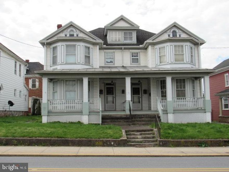 Are you a visionary with an eye for potential?  Step into the charm of yesteryears with this stunning Victorian duple waiting to be transformed into your dream home or investment property!  6 bedrooms; 2 full baths and 2 half baths nestled in historic Martinsburg.  The Duplex layout offers the versatility of two separate units-perfect for multi-generational living, rental income, or conversion into a single family home.  Character abounds with original hardwood floors and decorative moldings  Unleash your creativity and design flair to transform this blank canvas into a masterpiece, with endless possibilities for modern updates and customization.  The large back yard with 3 car garage borders an ally for easy off-street parking.  Customize and create a space that reflects your style and preferences, tailored to your needs and aspirations  The former owner lived in one side and had her business in the other!  Whether you're a seasoned renovator, aspiring homeowner, or savvy investor, this property promises endless potential and a rewarding  journey ahead.  Contact us today to schedule a viewing and embark on your journey to transform this Victorian duple into the home of your dreams!