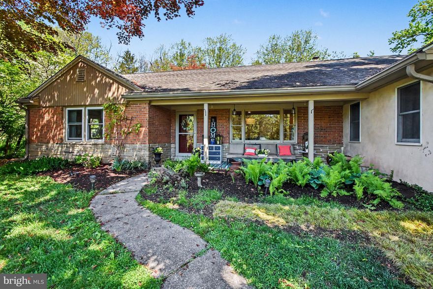 Nestled on a serene quiet street in the sought-after town of Phoenixville, this charming ranch home offers a perfect blend of comfort and functionality and is a gardeners paradise tucked back away. Described by many as "an oasis" it offers true privacy while being walkable to Phoenixville and the nearby schools. Built in the 1950s, this solid home boasts a well-maintained brick exterior and an inviting interior that radiates warmth. With over 1,700 sq ft of living space, this home features 3 spacious bedrooms and 2 full bathrooms. The front bathroom near the kitchen features new marble flooring, standing shower stall, new toilet, new sink, fresh paint and new fixtures. The rear bathroom was nicely updated with new flooring, fresh paint, bead board, and painted wall tiles. Down the hallway you will discover beautiful hardwood floors that flow through the formal dining area and into a cozy breakfast nook, perfect for morning gatherings. The family room, complete with a free-standing wood fireplace, views of the peaceful yard and a door to the patio, creates an inviting atmosphere for relaxation. The kitchen is equipped with modern stainless-steel appliances, including a double oven and electric range, making meal preparation a delight. The expansive lot, nearly 0.69 acres, offers a tranquil retreat with a partly wooded backdrop, providing privacy and a picturesque view of nature. Enjoy outdoor living on the recently added patio (30'x20') or quaint porch, surrounded by lush landscaping and mature trees. The property also features extensive hardscaping, ideal for entertaining or simply enjoying the peaceful surroundings. Conveniently located at the end of a quiet street, this home is close to local conveniences while offering a sense of seclusion. The unfinished basement (with 1 finished room previously used as a teen hangout space) provides ample storage with lots of shelving and potential for additional living space. Homeowners installed a French drain with lateral controls and an industrial de-humidifier. The well had a UV light added in 2020 and there is a whole-house generator serviced by propane tanks. This delightfully loved home is ready to welcome you home! Schedule a private tour today!