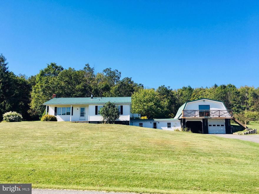 Cute country home with lots of storage space.   Spend your lazy days sitting on the front porch or in the back yard around the fire pit.  Home boasts a large master bedroom and living room with eat in country kitchen.  Basement has a large rec room and wood stove.  Two car attached garage with storage or activity room above.  All on just over an acre with great mountain views.  Privacy and nature at your fingertips and only a short drive to shopping and dining.  Don't let this one slip away.....
MORE PICTURES COMING!!!!!!