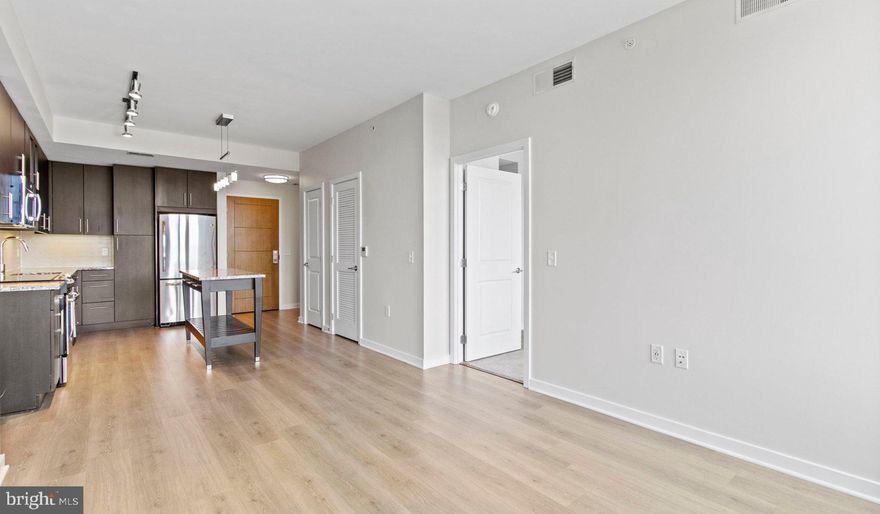 Nestled in the vibrant heart of Bethesda, Maryland, this luxury apartment complex offers an unparalleled living experience that combines modern convenience with sophisticated design. Designed to cater to the discerning tastes of urban dwellers, this property stands as a testament to luxury living, where every detail has been meticulously crafted to ensure the utmost in comfort and style.

*Exceptional Location*
Located in the sought-after Woodmont district, the apartment complex is perfectly positioned as a gateway to the best that Bethesda has to offer. Residents enjoy easy access to a plethora of amenities, including the Walter Reed National Military Medical Center, the NIH, and a variety of shopping, dining, and entertainment options. The prime location also offers convenient access to public transportation, making it easy to explore the wider metropolitan area.

*Architectural Elegance and Design*
The building's U-shaped design opens up to a beautifully landscaped courtyard, offering a seamless transition from the bustling city life to a tranquil oasis. The architecture is both richly textured and humanly scaled, creating an inviting streetscape that residents are proud to call home. A dramatic window wall façade and ground-level duplex units with front porches and planters further enhance the building's aesthetic appeal.

*Luxurious Amenities*
Residents of this apartment complex enjoy access to an array of exceptional amenities designed to enhance their lifestyle. The property boasts a large fitness center, fireside lounges, and a rooftop lounge equipped with bars, fireplaces, grilling areas, and two pools. Additionally, the convenience of having a 50,000 square foot grocery store within the building cannot be overstated. The property is also LEED Gold Certified, reflecting a commitment to environmental sustainability.

*Sophisticated Living Spaces*
The apartments themselves are a reflection of the luxury and sophistication that define the property. With a variety of floor plans, including studios, one to three-bedroom apartments, and townhomes, there is something to suit every preference. Each unit features designer finishes, stainless steel appliances, and spacious layouts that make coming home a pleasure.

*Community and Convenience*
The property is known for its friendly and helpful staff, ensuring that the needs of residents are met with professionalism and care. The well-maintained common areas and the sense of community fostered among residents make this complex more than just a place to live—it's a place to belong.

This luxury apartment complex in Bethesda, Maryland, offers an unmatched living experience for those seeking the best in urban living. With its prime location, architectural elegance, luxurious amenities, and sophisticated living spaces, it stands as a beacon of modern luxury and convenience. Realtors and renters looking for a property that combines the vibrancy of city life with the comfort of upscale living will find everything they desire and more at this premier apartment complex.

** Pricing and availability subject to change on a daily basis ** Photos are of model units ** Parking may be available for additional fee **