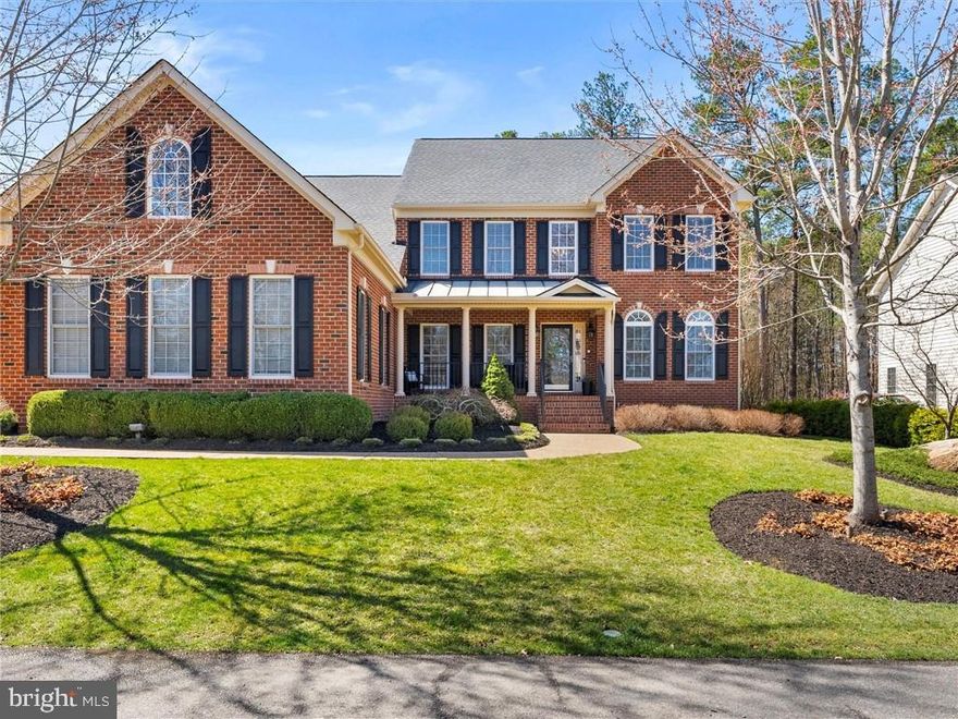 Exquisite Luxury Estate in the prestigious Bentley Community is perfectly positioned just minutes from Short Pump’s premier shopping, dining, entertainment and top rated schools. This 6,274 sqft estate offers elegance and modern upgrades w/ 6 bedrooms, 5 ½ baths & 4 finished levels! The expansive open floor plan on the first level flows seamlessly between the light-filled 2-story living room with a spectacular stone surround gas fireplace into the newly renovated chef’s kitchen (2024). The kitchen boasts quartz countertops, a custom backsplash, premium appliances, spacious island and gorgeous morning room with French doors leading to a lighted Trex deck. A 1st floor primary suite w/ tray ceiling, sitting area with bay windows, luxurious ensuite bathroom and 2 custom walk-in closets is a true retreat! The basement is an entertainer’s dream with a state-of-the-art home theater featuring a 110” projection system and high-tech surround sound paired with a full kitchen and bar area, full bathroom and game room. The second floor features four bedrooms – one with a custom accent wall and one with a generous built-in desk perfect for work or study. The finished third floor provides additional space for a 6th bedroom or play area. The backyard is a private retreat, offering a stone patio with gorgeous wood-burning fireplace and professional landscaping featuring pomegranate, apple, cherry, peach and magnolia trees. A 3-car garage and whole house generator complete this flawlessly updated estate offering a turnkey luxury lifestyle that must be seen to appreciate! Other recent upgrades and enhancements include Closet Factory custom closet & barn door new wireless 10 zone irrigation system (2023); 2nd & 3rd floor bathroom renovations (2022); New Bosch A/C & furnace (2021); Whole-house interior paint and powder room remodel (2021).