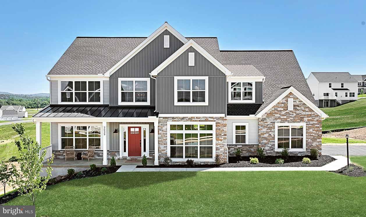 This craftsman style, 2-story home features 9’ ceilings on the first floor and basement, a 2-car, side-load garage with additional storage area, and a mudroom entry complete with built-in lockers. Stylish vinyl plank flooring flows throughout the main living areas. The foyer is flanked by a carpeted flex space and a dining room with a tray ceiling. A butler’s pantry connects the kitchen and dining room along with a spacious pantry. The kitchen is well-appointed with stainless steel appliances, quartz countertops with tile backsplash, and a large center island. Adjacent to the kitchen is a breakfast area with access to the composite deck. The cozy family room is warmed by a gas fireplace with stone surround. On the second floor, the owner’s suite boasts an expansive closet and a private bathroom with double bowl vanity, tile shower and a built-in bench. Three additional bedrooms, a full bathroom, laundry room and rec room complete the second floor.