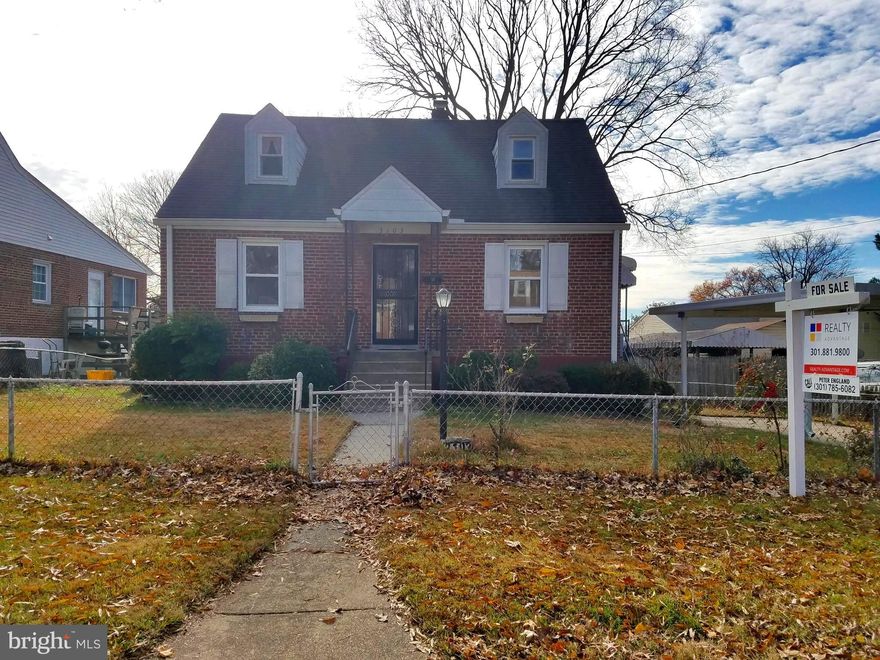 Beautiful all brick Cape Cod on large, level and fenced lot.  3 Bedrooms; 1 Full Bath,  freshly painted throughout, hardwood floors on main level, and all windows have been replaced.   Large lower level with walk-out to spacious yard.   Home is move-in ready!