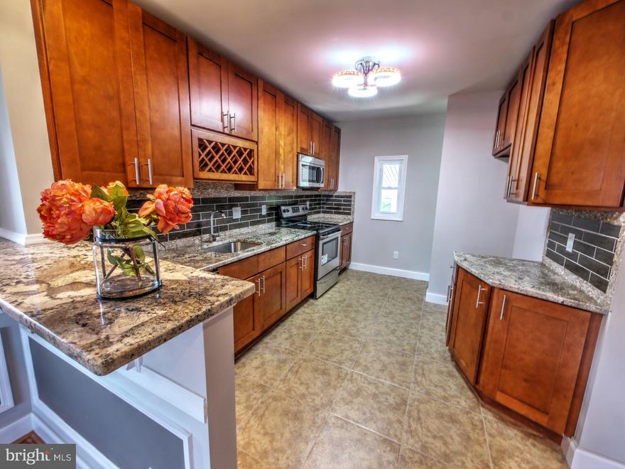 Tucked away on a quiet street in the Hollywood section of Jenkintown, this 3 bedroom 2 bath home has been completely renovated and is just waiting for your personal touches!  Enter through the covered front porch into the open-layout living and dining areas where you'll find beautifully refinished parquet floors, decorative fireplace, custom chair and base molding, and wall frames.  The knockout kitchen features brand new cabinets, lavish backsplash and imported tile floor, granite countertops, breakfast bar, wine rack, and stainless steel appliances (range, dishwasher, microwave).  Three nice sized bedrooms and a shared hall bath, where everything from tiles to vanity to tub is brand new, complete the main floor.  The newly carpeted basement offers a large area for entertaining or relaxing, an additional full bath, laundry room, and plenty of space for storage.  Don't overlook the warm designer colors and abundance of sunlight throughout, a huge rear yard, detached shed, rear covered patio, all new plumbing and electric, brand new central air HVAC system and efficient water heater.  Close to shopping, train station and public transportation, this spectacular home located in the award winning Abington school district has it all!  Disclosure:  Broker has financial interest. Driveway not included.