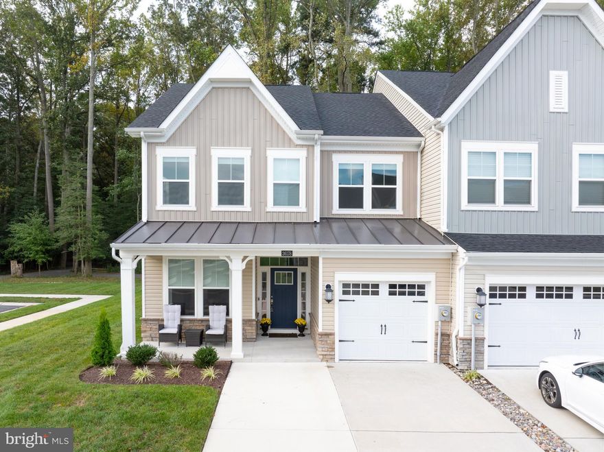 Price reduction! Modern sophistication meets coastal tranquility - welcome to 26178 Milby Circle. This nearly new Jefferson floor plan town home truly checks all the boxes. Located on a premium corner lot surrounded by green space on three sides - front, side and back yards - this home is the ideal retreat to relax and unwind. A maintenance-free lifestyle awaits you as the HOA maintains both the front and back yards, and lawn irrigation is also included. This stunning four bedroom, three-and-a half bathroom townhome greets you with bright and airy living spaces, a state-of-the-art kitchen, Luxury Vinyl Plank (LVP) flooring, and speciality lighting. A rare treat is the natural gas fireplace with stone surround - one of the few homes in the community to feature a fireplace. The interior spaces are luminous and inviting, enhanced by side windows that flood the home with natural light. A cathedral ceiling opening to the second-floor loft creates an airy, gallery-like space - ideal for displaying art or treasured pieces. The kitchen island is the centerpiece of the entertaining area, offering seating for six. Meals are easily prepared with the gas cooktop and double ovens. The first floor primary bedroom suite, off the Great Room, features a tray ceiling and custom light fixture. Two walk-in closets and an ensuite bathroom and an oversized, double-head walk-in shower complete the space. Finishing out the first floor are laundry and powder rooms. Upstairs is a second primary bedroom complete with a generous walk-in closet and ensuite bathroom. The adjacent Loft area provides another living area. Two additional bedrooms with ample natural light, large closets and custom light fixtures complete the upstairs level. A screen porch and paver patio are the perfect areas to either sip that morning cup of coffee or finish up the day with a relaxing al fresco meal. The back yard faces the walking path/tree line, providing both privacy and green space. The home has an extra parking space in the front, which combined with being an end-unit, makes for easier daily routines. This meticulously maintained home is only 8 miles from both Rehoboth Beach and Lewes. It is also a quick  to the Bays of the Long Neck area and Millsboro. The community has access to the single family home community of Walden - the two communities share a 5,000 square foot clubhouse with fitness center, outdoor pools, tot lot, pickleball courts, and a pier and kayak launch on Burton's Pond. In addition, there is a large courtyard, BBQ area, recreation room with a fireplace and wet bar for entertaining and games. The Villas at Walden also has a second outdoor pool located within the community, and has a walking trail around the community's perimeter. All of these amenities for a low HOA fee! This is more than just a home, it's a lifestyle.