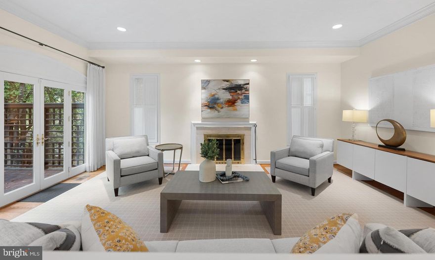 Tucked away on a quiet Berkley cul-de-sac, this 4,100 sq. ft. home blends spacious living with serene surroundings. The main level welcomes you with a bright living room and fireplace, French doors opening to a large deck, and a formal dining room perfect for gatherings. A versatile family room with custom built-ins doubles as a home office, while the eat-in kitchen features stainless steel appliances, a Thermador cooktop, and a cheerful breakfast nook. Upstairs, the expansive primary suite offers two walk-in closets and a marble bath with skylight, soaking tub, and separate shower. Three additional bedrooms with vaulted ceilings share a sunlit hall bath. The walk-out lower level provides a second family room with fireplace, recreation space, full bath, and access to the covered patio and landscaped yard - ideal for play and entertaining. A utility room, garage parking, and abundant storage add convenience. With mature trees, generous light, and easy access to Palisades shops, dining, parks, and downtown DC, this home is designed for both everyday comfort and family connection. *Please note: Square footage is estimated and calculated by an independent third party; information is deemed accurate but not guaranteed.