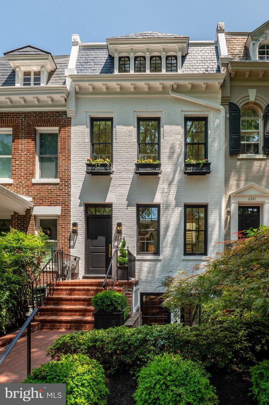 Indulge in the epitome of opulent living in this newly renovated masterpiece by District495 Properties. Located along one of Kalorama Triangle’s most captivating treelined streets, this extraordinary residence boasts 5 bedrooms, 3.5 bathrooms and approximately 3,200 square feet. Step inside the three-story haven and be embraced by an exquisitely designed open concept floorplan that effortlessly captures breathtaking vistas of the serene backyard oasis. 

Prepare to be entranced as every detail exudes timeless elegance. From the 7.5” wide White Oak Hardwood Floors to the hand-selected marble, 2 gas fireplaces, designer lighting, top-of-the-line Thermador and ILVE kitchen appliances, and Waterworks fixtures throughout seamlessly blending luxury and modernity. This showpiece residence is sculpted to perfection with architectural details and custom millwork throughout. 

The upper level is dedicated to 3 Bedrooms and 2 Baths including the Primary Suite that offers expansive ceilings, custom built-in wardrobes, a gorgeous marble shower and double vanity sinks, a dressing room with custom built-in shelving and more. Retreat to the bedroom nestled towards the rear of the home where expansive French patio doors unveil a private balcony, offering an elevated vantage point to admire the breathtaking beauty that surrounds you. 

The lower level of this magnificent property presents an additional family gathering area, wet bar, secondary washer/dryer, a bedroom and bathroom plus an additional room that can be used as a bedroom or office, and dual exits for convenience and comfort. Outside, a captivating backyard oasis awaits, adorned with 2 majestic Linden Heritage trees that stand tall, casting a lush canopy of shade and timeless beauty. Whether seeking private tranquility or a setting for unforgettable outdoor gatherings, this picturesque haven fulfills every desire. 

Completing this remarkable home are two secure parking spaces with an EV charger, with access from the spacious alleyway behind the residence. With meticulous attention to detail and no expense spared, 2323 20th Street NW represents the pinnacle of luxury, sophistication, and comfort. Situated in the highly coveted Oyster-Adams School District and one of the most sought-after locations in the Capital Region, this magnificent piece of real estate epitomizes exceptional living.