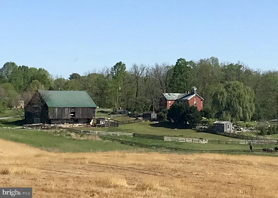 Welcome to the Bonnymeed Farm, a circa 1883, historically accurate, 3 bedroom, 2 and a half bath, 3,232 square feet, brick colonial on 11.7 unrestricted acres. This home has been lovingly cared for by the same owners since 1995. They are ready to move on to greener pastures and leave the rest of the finishing touches to you. Two zone propane heat and air, propane hot water, 3 working fireplaces, updated electric , 2 working wells (house and barn), 2 rooms with tin ceilings, built in shelves, wood floors and a cupula off the attic. The rear of the property has garden areas, raised beds, a small green house, 2 garden sheds, and a large pasture that is cross fenced for horses. To the right of the home is a large bank barn with all original features and has a lower area with 4 paddocks for horses or livestock. The bank barn was originally designed for cattle and is currently used for horses. The barn has its own well and has electric. The property is located on River Road in Shepherdstown, a peaceful, scenic and historical route, adorned with wildlife and majestic river, pastoral and mountain views. The kitchen and master bedroom side porches take full advantage of capturing these pastoral and mountain views, sunrises and sunsets. NOTE: This is a 11.7228 acre parcel being sold with one additional acre of potential pasture for use. Planning and Zoning stated new owners can subdivide again for family lot transfers. Buyer to do own due diligence to confirm any planning and zoning regulations in effect at this time.
