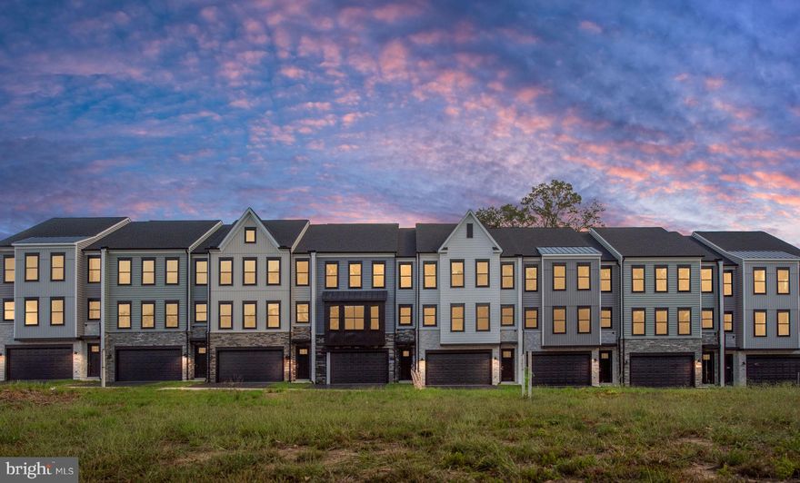 Move in Ready! All units back to woods! KINSLEY ESTATES LUXURY homes! Fabulous incentives on First row of 8 homes. Immediate deliveries! ULTRA LARGE 26'x50' townhomes, 30% wider than most townhomes! 500+ sf oversized two car garages. Across the street from Stafford Elementary School and short walk to Stafford Hospital and Stafford County government buildings, only two blocks. Commuters Dream, only 5  minutes to I-95 express lanes.  Close to Brooke Rd. VRE station (7 minutes)  and Brooke Point High School (4 minutes). Close proximity to new Stafford shopping complex and excellent dining and shopping in downtown Fredericksburg. This unit is MOVE IN READY NOW!  OPEN floorplan with 4 bedroom, 3 1/2 bathrooms and impressive room sizes due to the 26' width of the townhomes. Main floor bedroom with full bath and separate rear staircase to upper level. 18'6 x 15'2 Owner's suite with double walk-in closets. Conveniently located laundry room on bedroom level. 100" sleek fireplace, craftsman interior trim package, hardwood oak stairs to upper levels, gorgeous sleek upgraded quartz countertops in full bathrooms and kitchen, upgraded painted 42" frost maple cabinets with gorgeous contrasting flagstone maple island, tasteful tile backsplash in kitchen,  stainless steel appliances, induction cooktop, glass hoodvent, and upgraded flooring and lighting.  Hardwood look LVP on primary floor including foyer, kitchen, family room and powder room. 9' tall ceilings on all 3 levels. Contemporary and sleek black windows (exterior only black color), upgraded black garage door with remote opener.   Stone accents on front with custom hand-built metal awning. Concrete patio off rear yard. Fully sodded yard.  Incentives require use of a preferred lender and title company. See sales managers for details. Photos show decorated model home and actual home features are not all identical