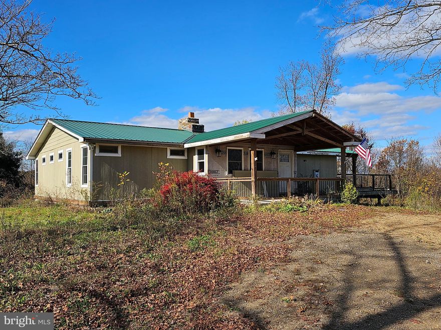 FIX IT YOUR WAY- turn this 4 bedroom 2 bathroom home on 2.5 acres into the home of your dreams. This home needs work for sure but the bones are there to fix it the way you want. Home features a living room, kitchen, family room with stone fireplace, 4 bedrooms & two bathrooms. Bedrooms 3 & 4 have bathrooms started or can be made into walk-in closets. Unfinished basement with a second fireplace can also be finished your way. Let's not forget the deck and the views to finish things off.  This property is private and unrestricted. Make this your home or invest to make it a home for someone else. Opportunities are there.