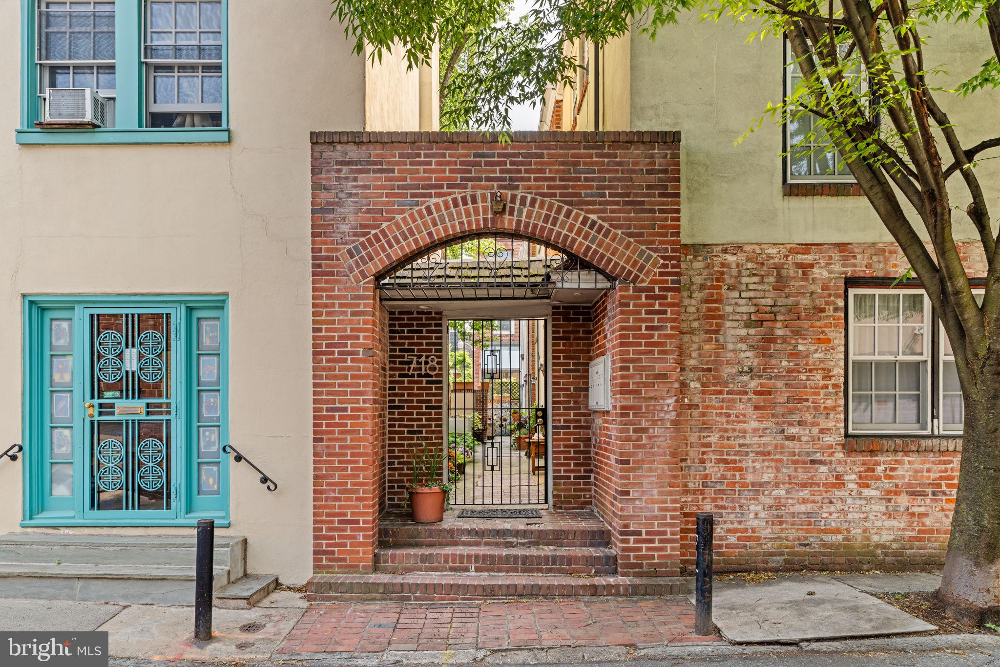 Situated just off of Perth and Addison Park in a private gated courtyard is 718 Addison Street, Home B. This two-bedroom trinity home offers a quaint retreat in Society Hill, with two fireplaces and a private roof deck.
Enter the private community through the gated front entrance, Home B is to your right. The main entrance opens into the living room where you’ll find hardwood floors, a wood burning fireplace and a dining room/kitchen. The kitchen is equipped with plenty of cabinet storage, a dishwasher, and a built-in microwave. Upstairs to the second floor you’ll find the first bedroom, large closet and full bathroom. The third floor is a sun-filled, open style bedroom with a second brick fireplace, vaulted ceilings and sliding glass door that leads to your newly updated deck with skyline views. Both bedrooms have plenty of closet space. Laundry and storage are located in the lower level. This quiet block is just steps from the beautiful Perth and Addison Park, local coffee shops and restaurants. Only 2 blocks from Washington Square Park, Jefferson and Pennsylvania Hospital.
Showings begin at the open house on June 14th. Saturday open from 12-2 and Sunday the 15th open from 12 - 1:30