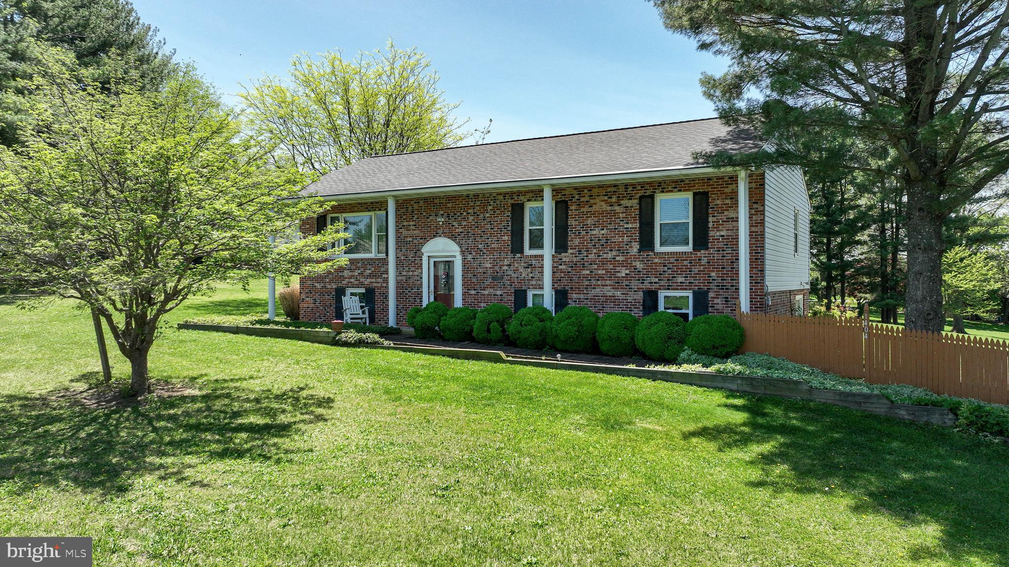 A little bit of country without being in the sticks. Just a few minutes to Westminster and all it has to offer. This well cared for 4-bedroom, brick front and brick to grade split foyer shows pride of ownership throughout. Wood flooring on most of the main level including the living room, dining room and 2 of the bedrooms. The kitchen has tile backsplash, stainless steel appliances and Corian countertops. Access to the 16 x 10 deck, with stairs to the ground level 16 x16 patio deck, from the dining room. The lower level has a large, finished rec room with a French door leading out the side, a bedroom with double closets and a den or office. Situated on a mostly level 1.72 acres with shed. The roof is approximately 6 yrs old and there are replacement windows.