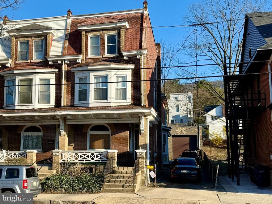 This grand early-20th-century brick home at 1543 W Market St offers timeless character with abundant exposed original woodwork, beautiful hardwood floors, pocket doors, a fireplace, and dramatic double staircases. Boasting 5 private bedrooms, over 2,100 sq ft, an enormous 2-car garage, with oversized doors, 15 foot ceilings, double garage door openers and a long private driveway, this diamond-in-the-rough needs some updating but is priced very aggressively for quick sale—perfect for the buyer ready to restore its full potential.