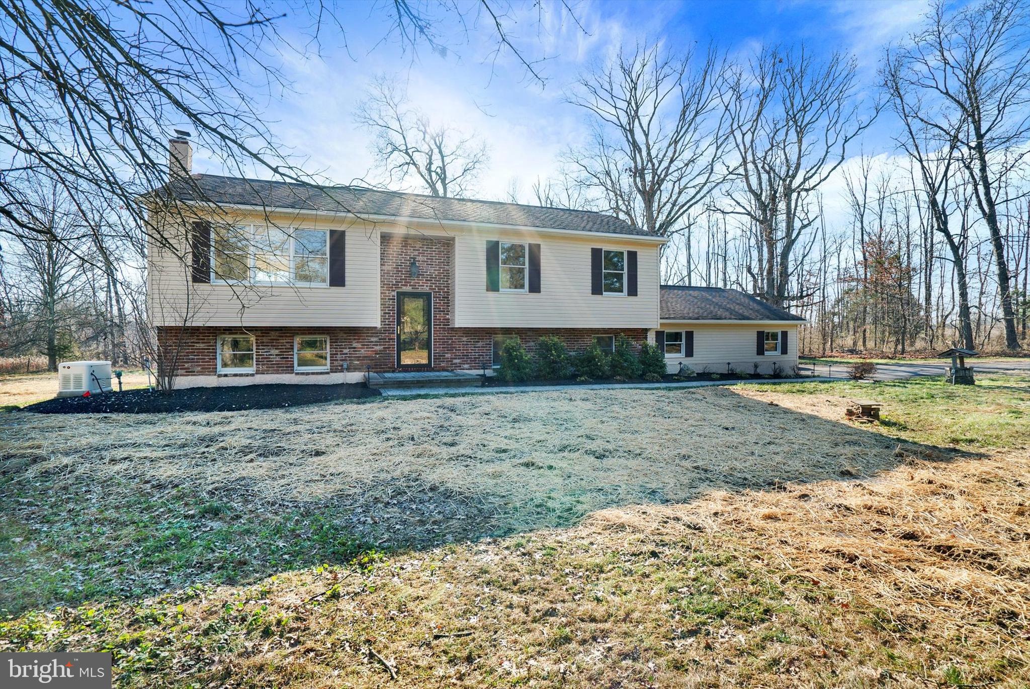 Colonial style home handsomely positioned in a secluded setting in Plumstead Township. The home offers three bedrooms and two full bathrooms on the main floor. The kitchen is bright with a farmhouse sink, pantry, plenty of counter space and cabinetry. The kitchen overlooks the breakfast room with glass doors leading out onto the deck. The family room is large is scale and showcases an oversized bay window for views of the front yard. Down the hall you will find the main bedroom with private bathroom and two additional bedrooms that share a full hall bath. The lower level showcases two finished spaces with a wood burning stove, laundry room and plenty of custom built ins for additional storage. This well maintained and immaculate home provides a whole house generator, all the rooms are on separate zones, a two car garage, shed and paver patio.