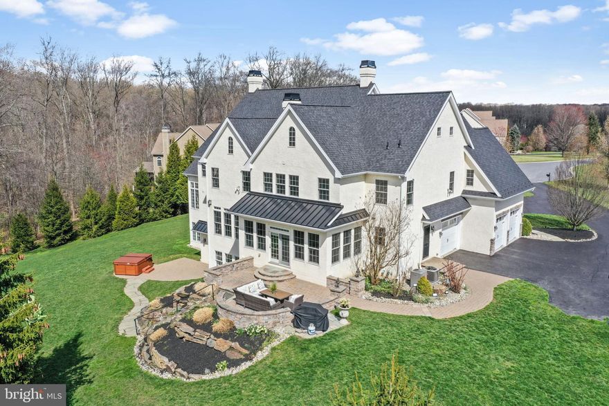 This stunning home is located close to shopping, dining, Longwood Gardens, Winterthur Museum, the award winning town of Kennett Square, Centreville, Greenville, Wilmington, Philadelphia and Maryland.  Situated on a stunning two+ acre lot, in the much-desired Carlton North Gate neighborhood of Chadds Ford, this professionally landscaped home is near 100+ acres of preserved open space and sits on a PREMIUM lot situated on wonderful, quiet, cul de sac. Originally the model for the subdivision, this home was masterfully designed with eye-catching architecture and built for entertaining with high-end finishes and amenities throughout. From the moment you pull up, you will appreciate the circular driveway in front of the home and the stunning curb appeal which includes a stunning, covered stone entry.  Once inside, there is a grand foyer flanked to the left and right by lovely formal dining and living rooms.   Through the living room, is an expansive sun room, perfect for enjoying a game of billiards or retiring to curl up with a good book.  The rear of the home is comprised of a spacious home office space, half bath, and an OPEN CONCEPT family room and chef’s gourmet dream kitchen.  The family room has wonderful views of the lovely back yard and a large stone gas burning fireplace while the adjacent gourmet kitchen has a large center island, upgraded granite counter tops, professional grade stainless steel appliances including a 6 burner, Viking gas range), and a separate breakfast room with doors to the beautiful paver patio just outside.  Just off the kitchen is a generously sized mud-room with built-ins that leads to the oversized three car garage. Front and back staircases lead up to a luxurious primary suite with a large, vaulted ceiling, a beautiful two-sided gas burning fireplace, a separate sitting room or TV area, two walk-in closets and a SECOND sitting room or bonus dressing room plus a beautiful primary bath with custom walk-in shower, soaking tub, and double sink vanity. There are an additional three en suite bedrooms all with private baths and generously sized closets. A spacious laundry room and walk-in hall closet complete the second level. The partially finished, daylight, walk-out lower level features a private home office space and a full bathroom; the unfinished space could easily be completed (quote loaded into the MLS). Just outside the walk-out level is a second patio area and a hot tub. New roof in 2021. One new HVAC in 2018, 2nd floor HVAC in 2020.  New well pump and well tank in 2020. Whole house generator in 2019 with a 10 year warranty.  This impeccably designed and maintained home is the jewel of the neighborhood.  Put this on your tour today and you will absolutely want to call it home.