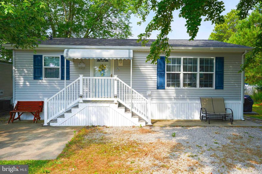 Your new Eastern Shore getaway - minutes to Ocean City! Immaculate 2BR/1BA cottage on a culdesac lot in the amenity-rich, gated community of White Horse Park - one of the locals' best kept secrets. Laze the days away at the community pool, or head to the OC Boardwalk for tons of fun. Venture out to Assateague Island to enjoy the natural beauty of the beaches and dunes, and of course the beloved wild ponies. This hidden gem is minutes to so many options for relaxation or entertainment - boutique shopping in nearby Berlin, world-class dining, watersports. Come live the good life in Worcester County - from the beaches to the bays and beyond! With its vaulted ceiling and open floorplan, this adorable cottage is welcoming - bright and sunny. New LVP flooring in the well-equipped kitchen w/crisp white cabinetry. Cute and cozy bedrooms are surprisingly spacious, and offer good storage. Full bath w/tub/shower combo. A matching storage shed offers plenty of space for your beach chairs. HOA fees of $165/mo cover water, sewer, trash, security, and a slew of amenities - Clubhouse w/ outdoor pavilion, boat ramp, basketball, playground, kayak racks, picnic tables and grills, bath houses with showers and bathrooms, laundry rooms. Boat slips at the marina are available for $550/season - each slip has water, electric, and a storage box.  Boat storage in the boat yard is only $50/year. Note - there are some limited restrictions as to when you can stay in community during winter months. April 1 to September 30, full time living allowed plus additional 60 days you can stay from October 1 to April 1. White Horse Park is open 365 days a year. Short-term rental potential! Sizes, taxes approximate.