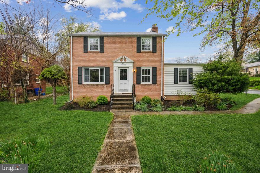 This elegant 4 bedroom, 2.5 bathroom brick colonial is located in the highly desirable Indian Spring neighborhood with an attached garage. The home offers over 2,000 square feet on a fantastic corner lot that spans over 8,000 square feet, complete with a flat backyard. The main level features a primary bedroom with an en-suite bathroom, a walk-in closet, and a skylight, as well as a convenient washer and dryer. The large living room, with a gas fireplace and brick surround, leads to a spacious dining room adjacent to the kitchen. The kitchen has been recently modernized with quartz counters and stainless steel appliances. Other highlights include a main-level powder room and beautiful hardwood floors that add to the home's appeal. The upper level includes a spacious bathroom and three additional well-sized bedrooms. Conveniently located inside the Beltway, it is in close proximity to Sligo Creek Park and a quick drive to the METRO and MARC trains. Downtown Silver Spring's shopping amenities are within a mile.