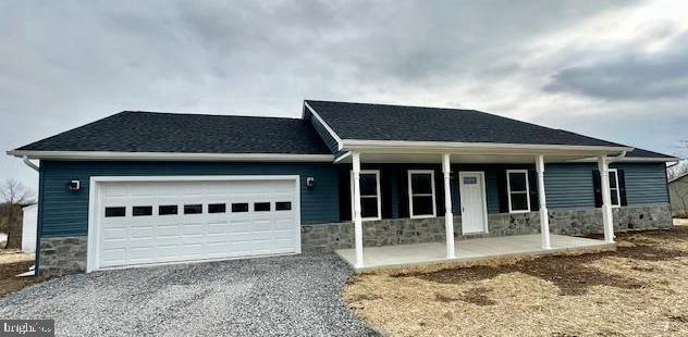 *** ALMOST COMPLETE AND SUPER AFFORDABLE - 1,700 SQ FT SPACIOUS RANCHER ON OVER 2 ACRES … JUST OVER VA LINE AND NO HOA!*** Located in a small, rural subdivision called Mohrs Landing and just 20 minutes from Winchester, this is the one level NEW CONSTRUCTION living that you’ve been waiting for! GORGEOUS DARK BLUE AND STONE exterior is finished inside with a neutral palette of white kitchen cabinetry, stainless steel appliances, luxury vinyl planking THROUGHOUT home including bedrooms and baths. Oversized decking off rear overlooks gorgeous mountain vistas and 2 mostly level acres. Front covered porch area allows for relaxing front porch sitting. Large 2 car garage has an additional finished room for storage. Large laundry room is conveniently located off garage and boasts tons of extra space. This brand new home will be a great starter or perfect retirement home! You won’t be disappointed by the great quality this home has to offer, as well as a 1-year builder's warranty! Large shed conveys.