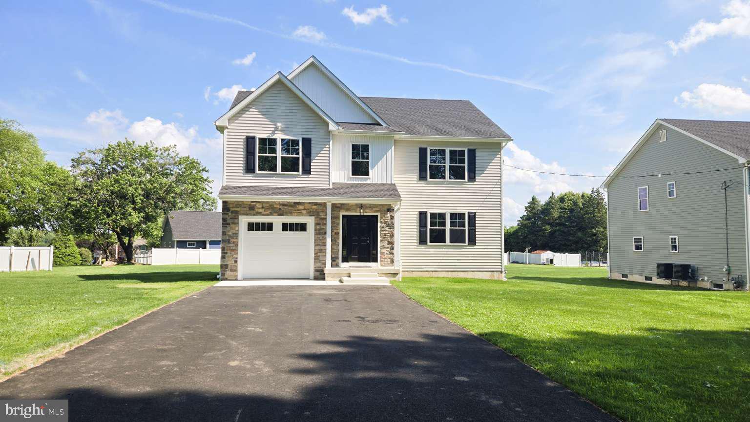 Hurry, only one left. Welcome to this quality new construction home with roughly 3600 sqft. of total living space on a half an acre lot with a large back yard with a beautiful Trex deck . The first floor has 9' ceilings, spacious living room open to the full eat in kitchen with tons of cabinet space, natural gas cooking and full stainless appliance package, formal dining room and powder room. The second floor has full laundry room, master bedroom with walk in closet and full bath, second bedroom is another full bath suite, two more bedrooms and full hall bathroom. The full finished basement is roughly 800 sqft. with a full bathroom and walk out stairs. Large one car garage with oversized door. Home has natural gas for heat, hot water, dryer and range.