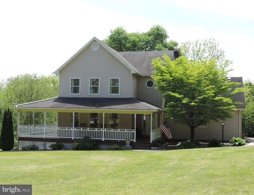 WELCOME HOME!  From the moment you step onto the wrap around porch you will feel at home.   This 4 bedroom, 2 1/2 bath home is situated on a 2.689 Net Acre lot.  Main level offers a living room, dining room, large kitchen with a breakfast nook, laundry room with utility sink and built in cabinets, family room with wood burning fireplace & mantel and a powder room off of the entry hall.  Wood flooring on the main level has been refinished.  Beautiful wood stairway overlooks the entry hall.  The upper level offers 4 spacious bedrooms, 2 full baths and a bonus room that is perfect for a craft room/play room or a home office.  The unfinished basement includes a wood stove and a walkout.  Neutral paint throughout.  The home has dual zone heat & A/C, natural gas, lots of storage &  400 amp electric service.  Seller reduced the septic reserve area to 20,000 sq  ft to allow for construction of outbuildings.  Fenced in area that's perfect for a play area for the kids & fur babies!  MOVE IN READY!  Seller has made numerous updates and improvements to this home in the past few years.  2021 main level wood flooring refinished,  2021 new basement door,  new front door 2020,  primary bath remodel 2019, new whole house water filter 2019, new well pressure tank and tank tee,  laundry room remodel 2018, new hot water heater 2018 and the list goes on.