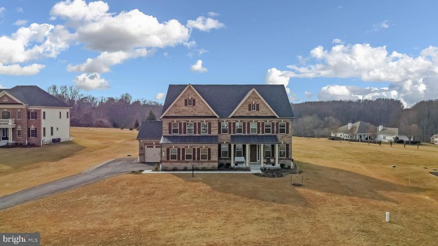 Absolutely stunning newly built 9 months old NV estate homes (Stratford Hall model) located near Howard county Top Rated schools are feature rich with additional options to fulfill every wish for your dream home nestled on a 1.25 acres lot. Over 5700+ sq ft. spacious home with 5 bedrooms, 6 full baths, and 1 half bath including tons of upgrades and ample sunlight throughout the house. Main level - First floor features a great room for gatherings, 2- story family room with coffered ceiling, and an in-laws suit with full bath, upgraded laminate floor, mud room, upgraded kitchen with SS appliances, granite countertops, center-island with pendant lighting formal dining with crown moldings, walk-in pantry, butlers pantry, a casual dining area, family room with fireplace and access to 20 ft x12 ft deck with covered porch, 9 ft+ ceilings, oak stairs. The private esate home boasts French doors, ceiling fans, and recessed lighting. Second floor includes four generous bedrooms with multiple walk-in closets. Owners suite with remarkable tray ceiling and an expansive walk-in custom closet with built in shelving. The luxurious owner's bath features double vanities, soaking tub, closet, oversized standing shower. All Additional bedrooms with private full bath, Laundry room with custom shelves. The basement includes a full wet bar plumbing, full bath and 8 ft walkup with double door. Water treatment system. Exterior features! Covered frontporch, Covered rear deck, 3 car garages with additional 4 car driveway parking.