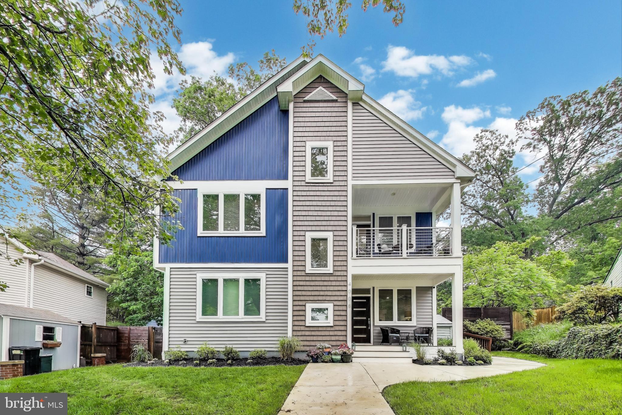 OPEN HOUSE: Sat, May 17 12:00 PM - 2:00 PM
Effortlessly stylish and thoughtfully designed, this three-level home offers the perfect blend of form and function—with distinct areas for living, working, relaxing, and entertaining, all under one roof.
Reimagined and nearly rebuilt in 2020, the residence features almost 3,000 square feet of beautifully finished living space, crafted with high-end materials, custom details, and a low-maintenance design that feels both luxurious and livable.
Set on a peaceful cul-de-sac, the home is introduced by a large, open front yard with attractive landscaping and mature plantings that enhance curb appeal. The inviting front porch, framed by a charming second-floor covered balcony, provides a welcoming first impression and a perfect spot to unwind.
The main level is bathed in natural light, where an open concept living room and formal dining area flow seamlessly into a chef’s kitchen. Anchored by an oversized island with seating, the kitchen is a standout with quartz countertops, custom cabinetry, designer tile and glass backsplash, farmhouse sink, recessed and pendant lighting, and premium stainless-steel appliances—including a walk-in pantry for added convenience. Just beyond, a sliding glass door opens to a large private patio complete with a wall-mounted flat screen television and panoramic views of the deep, fully fenced, professionally landscaped backyard—an ideal space for entertaining or relaxing outdoors.
A spacious main-level bedroom suite, complete with a generous sitting area, blackout window shades, and stylish full bath, offers a perfect solution for guests, au pairs, or multi-generational living. Throughout this level and the one above, 9-foot ceilings and wide-plank hardwood floors add warmth and elegance.
Upstairs, the second floor opens to a large, bright family room with a sleek wet bar, including a mini-fridge, wall-mounted flat screen television, and private balcony. The luxurious primary suite serves as a serene retreat, featuring a spacious sitting area, a custom walk-in dressing room with premium Elfa storage, a spa-like bath with a marble shower and dual vanity, and extraordinary storage space. Two additional bedrooms, a well-appointed hall bath with a deep soaker tub, and a convenient laundry area complete this floor.
The top level offers flexible living—perfect for a home office, gym, media room, play area, creative studio, or mixed-use space. The expansive rooftop terrace, framed by treetop views, creates a stunning setting for both quiet moments and lively gatherings and includes a wall-mounted flat screen television – perfect for watching your favorite team on game day, girls night movies, or your favorite shows.
Outdoor living is just as impressive. Nestled on a peaceful cul-de-sac, the home features a welcoming front porch and a fully fenced backyard with curated landscaping, mature trees, and perennial blooms that offer beauty and privacy year-round. Multiple serene seating areas invite quiet reflection, while two outdoor sheds provide ample storage for tools and equipment.
All of this is just minutes from scenic Rock Creek Park, Beach Drive, the antique shops of Kensington, and a variety of shopping, dining, and commuting options in Bethesda, DC, and beyond.
Comfort, style, and location come together in perfect harmony—this is more than a home; it’s a lifestyle.