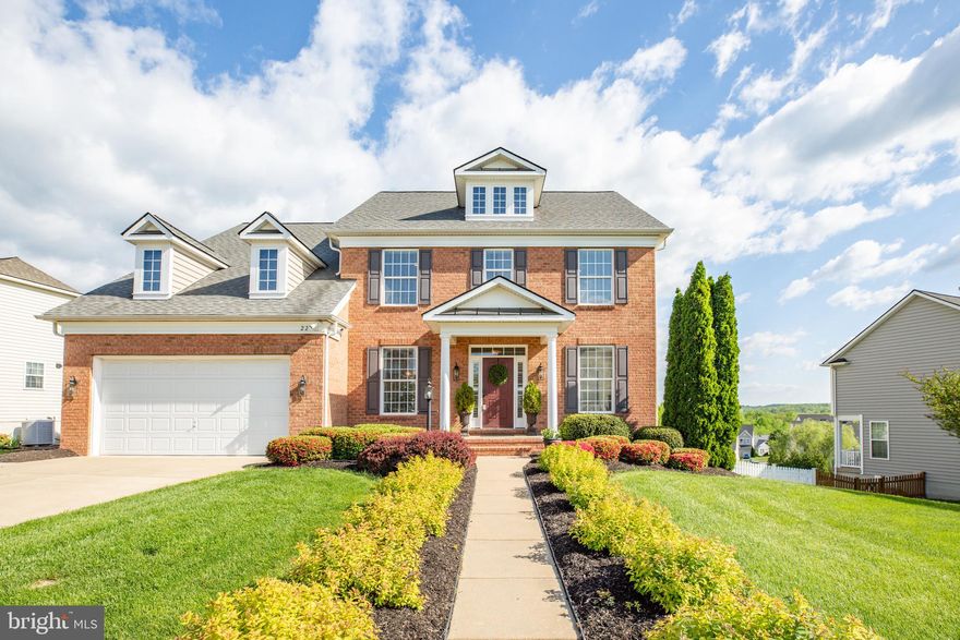 COME AND SEE this Gorgeous brick front semi-smart home located off of I95 (N/S) Exit 143 A and Rte 1 (Jefferson Davis Hwy).  This striking home presents a main-level in-law suite with full bath; formal dining room where you can host dinner parties; a comfy family room with fireplace; gourmet kitchen with double ovens and an island gas cooktop; dining area with access to 19' X 24' Composite rear deck, and laundry room with garage and side entrances.  On the upper level you will find three full baths and four spacious bedrooms, one of which is a huge master bedroom with separate sitting area.  Flooring throughout the home consists of beautifully maintained hardwoods, ceramic tile and carpeting.  The spacious lower level finished rec and bonus rooms with full bath, are great places for entertaining guests, hosting game nights, and/or provide guests sleeping accommodations.  Also, the lower level provides French doors that will provide access to a  beautifully landscaped yard with irrigation system.  The community is Hills at Aquia which is only minutes from shopping, restaurants, I95 (N/S), and about four miles from Quantico.  DON'T LET THIS DREAM HOME SLIP AWAY!