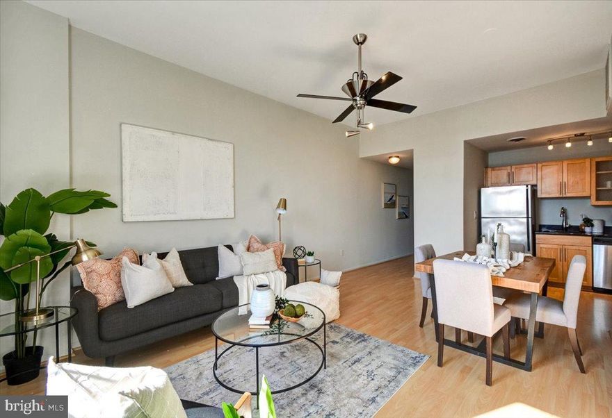 Welcome to the St Cloud! This updated SPACIOUS 1 Bedroom/1 Bath sun drenched loft-like condo with its 10' ceilings and oversized windows has amazing downtown city skyline views! This home touts beautiful laminate floors, stainless steel kitchen appliances, granite countertops, central AC, in-unit laundry hook-up, granite tile bathroom, oversized shower with double shower heads, and so much more.  Located just a few blocks from the inner harbor. Enjoy living in the heart of Mt Vernon, this vibrant area is close to restaurants, bars, cafe's, music venues, theaters, museums, parks, Sunday Farmers Market and more. Walkable to Peabody, University of Baltimore and MICA! Conveniently located off I-83 in the highly sought after Mount Vernon neighborhood, commuters can also make use of the nearby JHU shuttle stop which makes commuting to all Johns Hopkins locations a breeze. Only a few blocks to Penn Station for access to Amtrak and MARC trains for trips to DC, New York and beyond. Parking spot #15 is included in the sale! Perfect for professionals, students, or an ideal investment for any level investor. Schedule your showing today before it's gone!