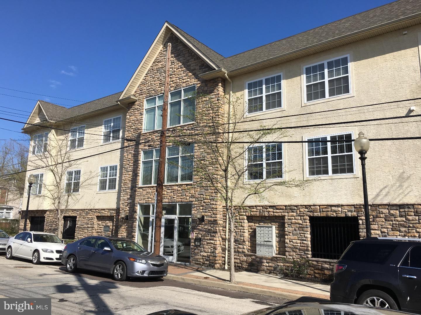 Nestled in the heart of Conshohocken, this impeccably maintained two bedroom condo is one of the best units at Hillview Condominiums. This home boasts a modern, open floor plan with a highly desirable split bedroom plan for ultimate privacy. There is hardwood flooring in the kitchen, dining area, and living room. The gourmet kitchen features granite countertops, stainless steel appliances, 42" cabinets, spacious pantry cabinet, and abundant counter space. The owner's suite has a private full bathroom and walk-in closet. Washer, dryer, and refrigerator are included. This is one of the few units that have outdoor space. Not only does this home have a double-sized deck, but it comes complete with spectacular southern views. A perfect place to unwind from a hectic day. Hillview offers elevator access as well as secure entry and exit from the front and the garage. There is also bike storage on the third floor. Easy walking/biking to the Schuylkill Trail, Conshohocken train station, Feine coffee shop, and local restaurants!