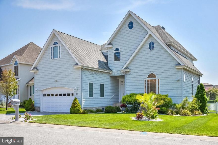 Magnificent luxurious custom 5BR/5.5BA direct waterfront home in Heron Harbour, one of the finest communities in Ocean City, is now available for sale. This home is stunning with spectacular canal and Bay views and desirable southern exposure.  From the minute you walk in the front door you will fall in love with this home. There is a large family room with a gas fireplace for year around enjoyment, and a gourmet kitchen with white cabinets, breakfast bar, Corian counter-tops and stainless steel appliances. is a custom dining area and built in bar area directly off the kitchen, and a first floor master bedroom with breathtaking water views.  The lavish master bath has marble floors, a large custom corian shower and a jacuzzi tub.  The back deck is very private and has incredible views