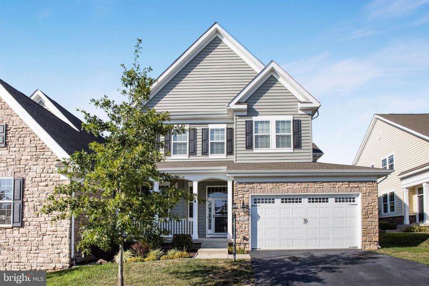 Welcome home to this like new 4BR 4.5BA Elegant, spacious and bright Semi-Detached Home! Located on a Cul-De-Sac to bring peace and quiet to your family. Plenty of parking spaces and trail access to Goose Creek. Beautiful hardwood floors throughout the main level. Brand New Carpet in Lower Level. The open floor plan and a gourmet kitchen create a perfect space for entertaining leads to a deck and fenced backyard overlooking the treed area. Breakfast nook, granite countertops and stainless steal appliances. Kitchen opens up to the great room with a cozy fireplace, work/study and a fabulous living and dining room. On the upper level gorgeous master suite has a sitting room as well as separate tub, shower and vanities. One of the three additional bathrooms has it's own en-suite bathroom. The fully finished basement has a large open recreation space, full bathroom, and ample storage. An unfinished bonus room provides options for a gym or additional storage. Goose Creek Community amenities include an outdoor pool, tennis courts, daycare, playgrounds, and fitness center. Silver line bus stop at the roundabout goes to the Ashburn Metro Station. Close to Dulles Toll Road, Dulles Airport, Goose Creek Village & Broadlands Village Center shopping.