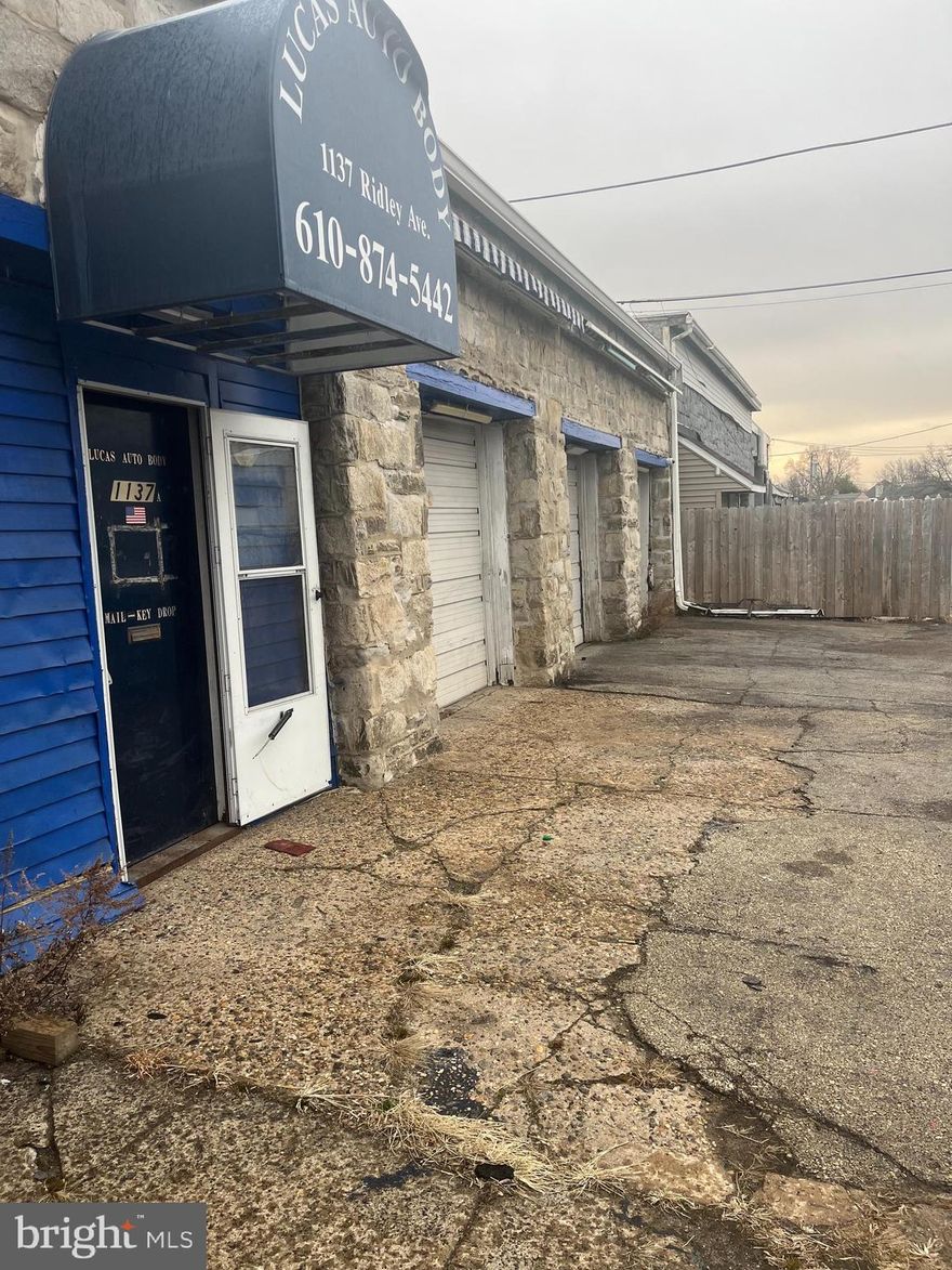 Welcome to this exceptional commercial garage space, perfect for automotive entrepreneurs or those seeking a versatile industrial property. Includes private office with security, cable, phone hook ups. Formerly utilized as a thriving auto body shop, this facility offers three spacious garage bays, providing ample room for vehicle service, repairs, or other commercial uses. Each bay is equipped with high ceilings and large doors, ensuring easy access for all types of vehicles. Additionally, the property boasts a dedicated interior space designed specifically for a painting booth. Located in a prime area with easy access to major highways, this property presents a unique opportunity for growth and success within a variety of industries Don’t miss out on the chance to make this well-maintained and strategically located garage your own business hub!