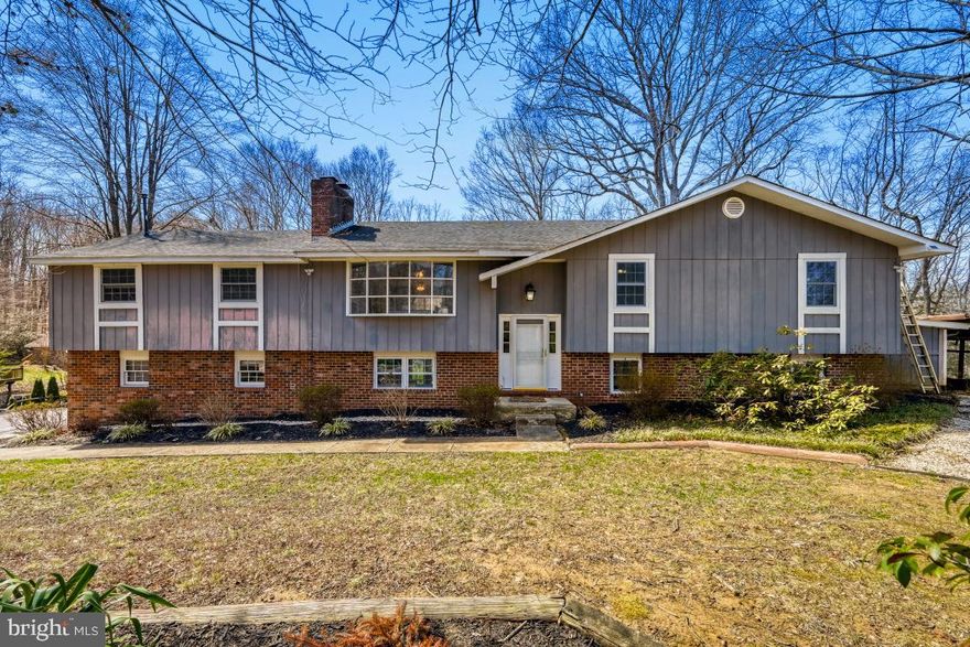 Peace, serenity, and space—just minutes from downtown Annapolis! This beautifully maintained home offers over 3,200 square feet of living space featuring 5 bedrooms, 3 full bathrooms, and three expansive living areas, providing plenty of room to relax, entertain, or work from home.

The spacious, sun-filled kitchen flows effortlessly to a large deck overlooking the fenced backyard, creating the perfect setting for outdoor dining, gatherings, or simply enjoying the peaceful surroundings.

Major updates between 2016–2018 include HVAC, roof, most windows, well pump, and electrical panel, offering peace of mind for years to come.

Perfectly positioned on over 2 private acres, this property is surrounded by county-owned reserve land, giving you exceptional privacy and natural beauty. Located in the highly sought-after Crofton Woods Elementary School district, this home combines space, location, and lifestyle in one rare opportunity