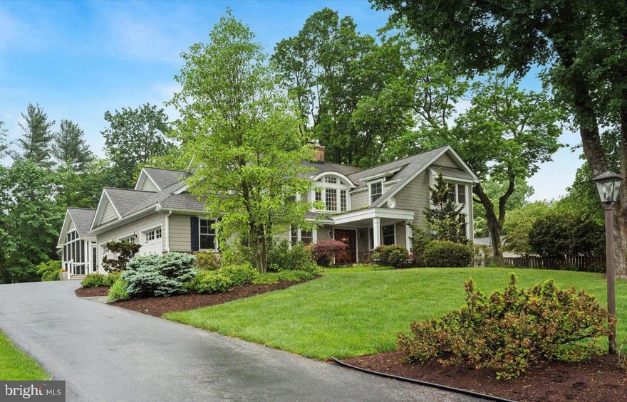 On A Cul-De-Sac in Woodlea-Bair-Conestoga -- one of the most sought-after neighborhoods in Berwyn, (walking distance to TE Middle & Conestoga HS, the R-5 Train, and Berwyn’s shops & eateries) -- offers this exceptional home, totally transformed from a traditional Colonial into an architectural masterpiece. Without sacrificing any of the charm so coveted by those who value the characteristics & appeal of timeless design, the planning & execution of this complete renovation and added sq. footage is nothing short of excellence. Beautifully landscaped, the front yard displays a slate walkway leading to an impressive entry doorway. The two-story Foyer beyond is spacious & beautifully appointed w/custom millwork, oak hardwoods, a double coat closet & a stunning staircase, leading to the 2nd flr Gallery. With a nod toward accommodating the needs of the work-from-home era, there are TWO 1st floor offices. One is traditional in décor, w/a fireplace, incredible millwork, dark stained paneling, pocket doors leading to the Dining Room, & enough custom storage & shelving to display the most extensive library. Like most other rooms in the home, you’ll find hardwood floors, abundant recessed lighting &  built in speakers here. The second home office is light & bright w/honey-stained cabinetry; an attractive cushioned window seat overlooks front vistas, beckoning for reading or contemplation. A second access door leads to a rear hallway, where both a Powder Rm & custom bookshelves are present. Beautifully crafted bookshelves can be found almost everywhere you turn. To the right of the Foyer, discover a banquet-sized Dining Room (fireplace, 3-piece chair rail, crown & picture molding, & wet bar w/wine refrigerator). Toward the rear of the residence, find 2 family spaces: one w/fireplace, bright windows & a door leading to the yard. The 2nd, at the back of the home, features an abundance of custom bookshelves & a corner desk – a great homework spot. An array of handsome custom cabinetry in the well-proportioned Kitchen presents space for every bit of equipment, dinnerware & pantry item the gourmet chef desires. With solid surface counters, propane cooktop, double oven, backsplash & double sink, the perfect meals or hasty snack are easily achieved. Overlooking the Kitchen, the casual Breakfast Room provides access to a gorgeous slate Patio & beautiful screened Porch (cathedral ceiling, two ceiling fans, slate floor, second Powder Rm). The Porch also leads to a portico-style covered portion of the Patio, featuring a hot tub. Just a step from the 3-car garage (pull down storage) or the driveway, is the ever necessary Mud Rm – shoe storage bench, coat storage cabinetry, heated ceramic tile floor, & a rear staircase to the 2nd floor. The upper level of the home displays 4 expansive bedrooms (all with hardwood flooring), and 3 full Baths. The Primary Bedroom w/ sitting area (currently an exercise room) proudly displays cathedral ceilings, ceiling fan, and two walk-in closets, while the primary Bath can truly be described as a spa w/cathedral ceiling, 2 separate vanities (quartz counters), a triple-sized spa shower, privacy commode closet & radiant floors. The remaining bedrooms feature huge closets – the largest BR is an ensuite. A hall Bath serves the remaining 2 bedrooms & features double sinks, linen closet & tub/shower. The Laundry Room w/sink, ironing center & a folding counter is on this level. There’s more to come! A finished 3rd floor, perfect for a 5th bedroom, a studio or playroom -- even a closet & a powder rm – & a multi-function finished walk-out basement. On this level, discover a carpeted area for casual entertainment, a full Bath, Billiards Room w/brand new radiant heated floors, a wall of custom cabinetry, wet bar w/ice maker (cork floors) & a huge temperature controlled wine cellar. Last but certainly not an afterthought, is the verdant flat back yard,
landscaped for privacy and outdoor entertainment.