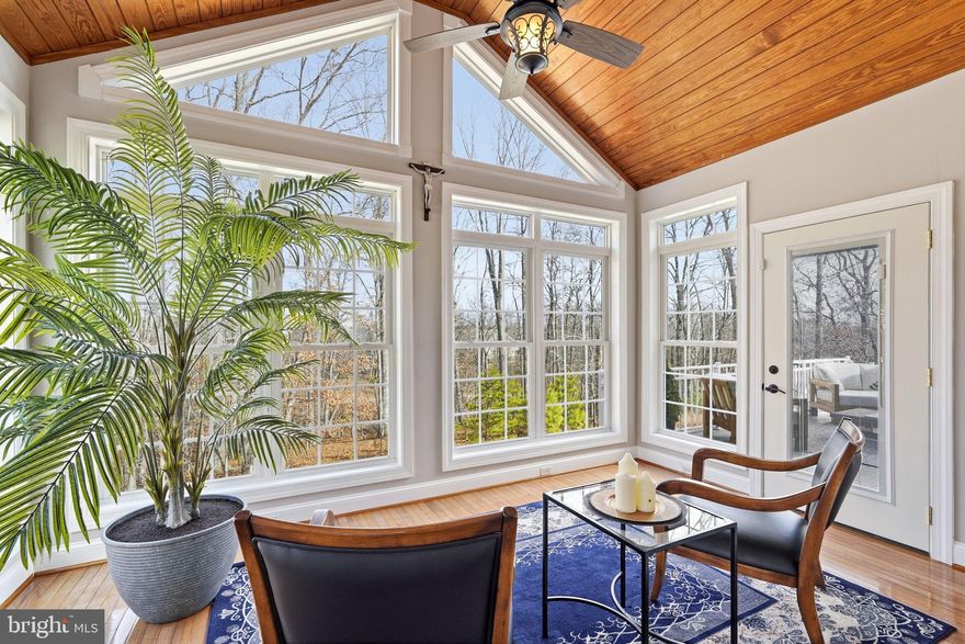 Welcome home to Lake Frederick's 55+ community with this gorgeous home nestled on the clubhouse side of the lake with a secluded, tree-lined homesite featuring tranquil views and privacy. This extensively renovated and stunning 5,200+ square foot residence spans three fully finished levels and showcases abundant natural light, refined living spaces, and a seamless blend of elegance and everyday comfort.
<br><br>
A beautifully crafted paver walkway welcomes you to the front entrance and into a striking main level defined by soaring ceilings and an open, airy design. The expansive great room is anchored by a warm gas fireplace and transitions effortlessly into the dining area and a completely renovated gourmet kitchen (2022) featuring, granite counters, stainless steel appliances, and well-planned cabinetry. Just beyond, the breakfast room offers a comfortable spot for everyday meals and opens directly onto the spacious Trex deck - an ideal setting for entertaining or unwinding while enjoying views of the fenced backyard, mature trees, and the lake beyond.<br><br>
The main level includes two private ensuite bedrooms, highlighted by a spacious and luxurious primary suite. The primary bath was thoughtfully renovated in 2024 and delivers a true spa experience, complete with a corner soaking tub and a separate walk-in shower. Oversized closets are found throughout the home, enhanced by custom Econize closet systems (2025) and a beautifully designed pantry that blend function with refined organization. A secluded office, positioned behind glass French doors, offers an ideal work-from-home retreat and opens into the enclosed sunroom, with direct access to the rear deck.<br><br>
Upstairs, a versatile loft area with built-ins overlooks the main living space and is ideal as a secondary lounge or reading area. This level also includes a third bedroom with its own full ensuite bath and walk-in closet, offering privacy and comfort for guests or family members.
<br><br>
The walkout lower level expands the living space significantly and is designed for both recreation and relaxation. It includes a large recreation room, a separate lounge area with a bar, plenty of room for a home gym as well as the fourth bedroom and a gorgeous fourth full bathroom complete with a sauna that is negotiable if you'd like to include that with the purchase of this beautiful home. There is also a substantial unfinished storage area, ensuring plenty of room for seasonal items and long-term storage. The lower level opens directly to the fenced backyard and covered outdoor patio, complete with ceiling fan and lighting for year-round enjoyment.
<br><br>
Additional highlights include a whole-house water filter, newer roof (2017), newer HVAC (2024), and newer hot water heater (2025), renovated kitchen (2022), remodeled primary bath (2024), and custom closets (2025) offering peace of mind for years to come. The two-car garage features boat/kayak lift storage, complementing the home’s serene lake-adjacent setting.  With its spacious layout, abundant natural light, and exceptionally private setting, this home truly offers a rare combination of space, comfort, and lifestyle.
<br><br>
As a resident of Trilogy at Lake Frederick, you'll enjoy a wealth of incredible amenities designed to enhance your lifestyle. Dive into relaxation with both indoor and outdoor pools, stay active in the state-of-the-art fitness center, and unwind at the well-equipped community clubhouse. Savor gourmet meals at the farm-to-table restaurant and socialize in the exclusive members-only lounge. For the sports enthusiasts, tennis and pickleball courts, as well as a dog park, offer ample opportunities for recreation, while extensive lake trails beckon for serene strolls and outdoor adventures. Join a vibrant community of welcoming neighbors and future friends. Experience the pinnacle of resort living at Trilogy at Lake Frederick—where your dream home and ideal lifestyle come together seamlessly.