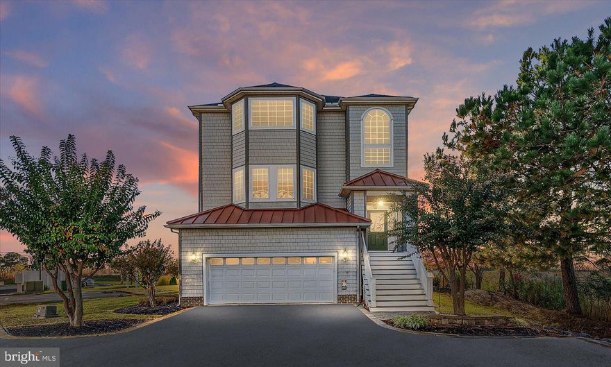 Discover your perfect getaway in this exquisite SINGLE FAMILY DETACHED 4-bedroom, 3.5-bath home, ideally situated in the desirable Sunrise Cove community. With close proximity to local eateries, Sunset Marina, and a convenient boat ramp, this home is a boater's paradise and an entertainer's dream. Inside is a spacious and inviting layout that combines luxury and comfort with 9 foot ceilings throughout. The second level features an owner's suite with a cozy wet bar and gas fireplace. With 2 additional bedrooms on this level for ample space. Enjoy the convenience of an elevator that serves all floors and is maintained by Delaware Elevator. HVAC has service plan Coastal Series AC units, 3 zones, wifi thermostat on each floor. HOA fees include grass cutting, landscaping, trimming flowers, trash, flood insurance, general insurance, driveway maintenance.