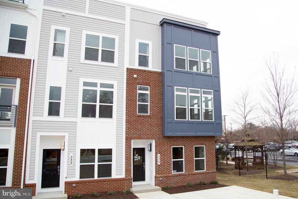 Ready For Move In! Annapolis Brick Front End Unit has 2 Car Rear Load Garage, 3 Bedrooms, 2 Full Baths and 2 Half Baths on 3 Finished Levels! Oak Stairs. Kitchen Upgraded with Gourmet Stainless Steel Appliances and Quartz Counters and Extended Island. Sundeck off of Family Room! Finished Rec Room and Half Bath. Closing Cost Assistance Available