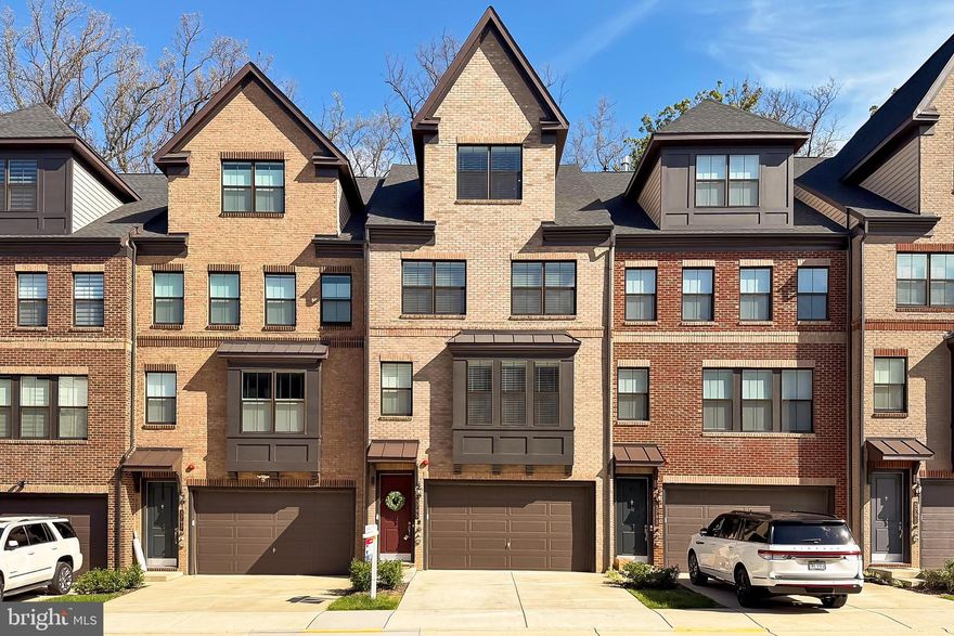 **Check out the video tour** Welcome to 3795 Rainier Dr — a spectacular, nearly new townhome offering luxury, space, and an unbeatable location. Situated on a premium lot backing to lush, private tree views, this 3-year-young home spans an impressive 3,506 square feet with 4 bedrooms, 5 full bathrooms, and beautifully curated finishes throughout.
Step inside and immediately appreciate the expansive open-concept floor plan, anchored by a show-stopping kitchen. Highlights include a massive Blue Lagoon Quartz center island, rich Wentworth Maple cabinetry with staggered glass inserts and soft-close drawers, gas cooking with double oven, and a walk-in pantry fit for any chef.
Upstairs, the spacious primary suite serves as a true retreat, featuring dual walk-in closets and a spa-inspired bath with a seamless glass shower, Winstead Birch cabinets, and a Stellar Gray Quartz vanity. For added convenience, the laundry room is located just outside the primary suite.
Need room to spread out? The private loft suite offers a full bedroom, bath, rec room, and a terrace — ideal for guests, teens, or a home office sanctuary. The fully finished walk-out basement includes an additional full bath and provides flexible space for entertaining, fitness, or media.
Enjoy outdoor living on the large composite deck off the kitchen — perfect for morning coffee or evening gatherings with friends.
Location-wise, you’re walking distance to shopping and dining, with quick access to major commuter routes and Dulles International Airport. All this, plus you're located within the highly sought-after Navy ES, Franklin MS, and Oakton HS pyramid!
Experience the perfect blend of elegance, functionality, and convenience at 3795 Rainier Dr — where luxury meets lifestyle.  CALL JESSICA FOR A PRIVATE SHOWING TODAY!