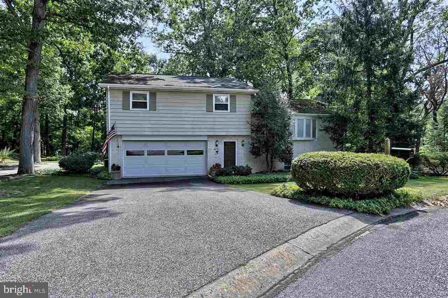 Beautifully maintained split level in Dallastown School District.  This home on over 1/2 acre offers 3BR, 2.5BA, FR w/fireplace and walk-out to deck, wood and tile floors, replacement windows, kitchen with corian counters and ample cabinets, newer paint and carpeting, cedar closet, new roof Fall of 2016, 2 car garage, beautiful wooded views all on a cul-de-sac.  This pristine home is move in ready.  You will fall in love!