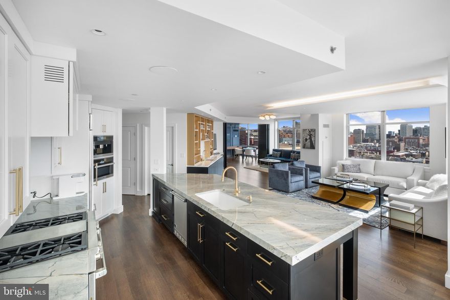 This residence was not just renovated, but reborn under the direction of the trailblazing Ginger Woods Design firm. This avant-garde space isn't just stylish—it's a revolution in tasteful urban living. Through a sun-soaked entrance, you're thrust into a vast living expanse with 270-degree city views. The details that gave birth to the Modern Mozart’s Edgy Elegance are limitless. One obscure example of detail, not recognized at first glance, is that each of the boards that comprise the white oak flooring were hand selected to create a subtle movement of grain.  Stretching an audacious 35 feet, the living room is more of an arena, with nooks that defy convention. a meticulously handcrafted bespoke wet bar, back lit shelving and a Dolomite stone backsplash that sets a tone that challenges the mundane and transforms an evening mood into that of a nightclub or lounge. 
The Kitchen? A chef's takeover dream, draped in artisanal cabinetry, curated quartzite surfaces and appliances that scoff at mediocrity. The Primary Suite? Think penthouse opulence with sprawling seating, wardrobes you could live in and a bathroom that feels like a five-star spa—custom walnut cabinetry, Dolomite stone floors/counter tops and heated floors for those chilly winter mornings. Bedroom Two is equally stunning—with its own luxe bathroom and spacious walk-in closet(s). Venture further and discover Bedroom Three or alternatively your home office or game room, perfect for late-night gaming or a rogue guest stay.  Additional features include a central control system including speakers throughout, and a shading system for those sunny days.  All windows are treated with a UV film to protect the floors, furniture and artwork. 
Enjoy the convenience of two self-park spaces, double storage, a secluded balcony and well-managed building perks like gatekeeping door attendants and staff that have become “fixtures” at the Symphony House. Take a dunk in our lavish pool or workout to your heart’s content (or max HR) in our fully outfitted gym that adjoins endless outdoor space for breaks between sets. Nestled amidst the heartbeats of parks, edgy eateries, the Kimmel Center, the theatre district and chic boutiques, this home isn’t “your ordinary build”—it's a lifestyle statement.