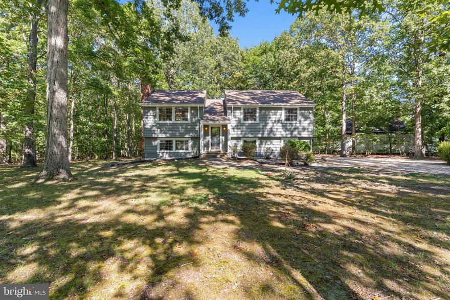 Move in Ready, 5BR, 3BA Split Foyer is Sited on a PRIVATE Level Lot & NO HOA! Highlights and Features Include Living Room w/Wood Burning Fireplace, Ceiling Fan & Conveying Sony TV; Dining Room w/Ceiling Fan & French Doors to LARGE Tiered Deck; Kitchen w/Breakfast Bar, Pantry Cabinets w/Pull out Shelves & Double Sided Cabinets, Deep Sink w/Commercial Style Faucet; Primary Bedroom w/Carpet, Ceiling Fan & Double Door Closet; UPDATED Primary Bathroom w/Step in Shower & Floor to Ceiling Ceramic Tile Surround; Bedroom 2 w/Built in Desk; Bedroom 3 w/Double Door Closet; UPDATED Bathroom 2 w/Ceramic Tile Floors, Tub/Shower & Ceramic Tile 1/2 Wall Complete the Main Level. The Lower Level Features a Den w/Fire Place w/Wood Stove Insert; Laundry Room w/Cabinetry, Utility Sink & 2 Addition Sinks, Conveying Washer & Dryer, Door to Side Yard; Bedroom 4 & 5 w/Carpet & Double Door Closet; UPDATED Bathroom 3 w/Ceramic Tile Floors, Vanity w/Storage & Step in Shower w/Floor to Ceiling Ceramic Tile Surround Complete The Lower Level. Additional Highlights Include LARGE Circular Driveway; Level Yard that Backs to Trees; Double Door Shed; NEWLY Cleaned & Sealed HUGE Tiered Rear Deck w/Stairs To Grade; Raised Garden Bed; NEST Thermostat; UPDATED ROOF w/Architectural Shingles(2020); UPDATED Vinyl Siding(2020); UPDATED HVAC(2019); UPDATED 50GAL Water Heater(2023), Vinyl Double Pane Windows. Don't Miss Out on a Beautiful, Conveniently Located Home Close to I95, Commuter Lot, Restaurants & Shopping in Southpointe & Central Park and Much More!