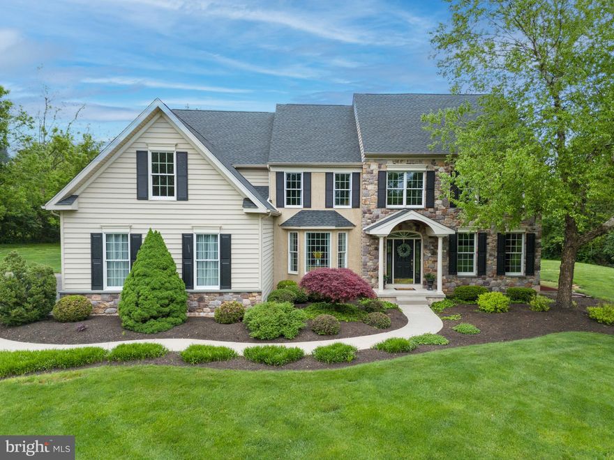 Seller willing to Negotiate for a June 28th Settlement date. 
Don’t miss out on this beautiful 4 bedroom / 3.5 bathroom colonial with over 4,600 sq. feet of living space and built by award winning local builder WB Homes Inc. This amazing home sits way back on its own serene setting and is situated on a gorgeous 2.24 acre lot in the very popular Greenbriar Estates neighborhood in Towamencin Township, North Penn School District. As you come up the winding driveway you will appreciate the tranquil setting & upgraded landscaping this home offers. The main level offers the upgraded kitchen with hardwood floors, 42’’ cabinets, granite countertops, double oven, center island w/ bar top seating, pendant lighting, breakfast / sunroom area with French door to the rear patio. The kitchen flows into the two-story family room w/ hardwood flooring, stone floor to ceiling wood fireplace, wall of windows & plenty of room for the big screen TV.  It’s an easy transition from the kitchen to the formal dining room with a convenient butler’s pantry & coffee station separating the rooms. The formal dining room has accents including hardwood floors, bay window, crown molding & tray ceiling. The main level also includes the formal living room, currently used as a home office w/ new carpeting & upgraded trim work. (The seller will leave the desk system if a buyer is interested.) The other 1st floor study is currently used a relaxing den & bar area. Lastly the main level offers the mudroom & half bathroom. The dual staircase has hardwood risers leading to the upper level with three spacious guest bedrooms, two hall bathrooms & luxurious owners suite. The primary bedroom includes cathedral ceilings, two walk in closets, sitting room & luxury bathroom w/ dual vanities, soaking tub & stall shower. The finished basement includes the family room w/ gas fireplace, crafting area, large exercise area & two full storage rooms. You will absolutely love the outdoor living space this home offers w/ the oversized paver patio overlooking the wonderful setting. The sellers have spent many days & nights entertaining and enjoying the natural beauty, this space offers plenty of room to play & entertain.  Recent updates include new roof 2020 & new carpeting 2024. As an added bonus this home is located just two minutes from General Nash Elementary school and is conveniently located just two minutes from the North East Extension of the Pennsylvania Turnpike w/ easy access to the Leigh Valley, King of Prussia and Philadelphia. This home also located five minutes from historic Skippack Village with lots of wonderful antique shops and fine dining.
